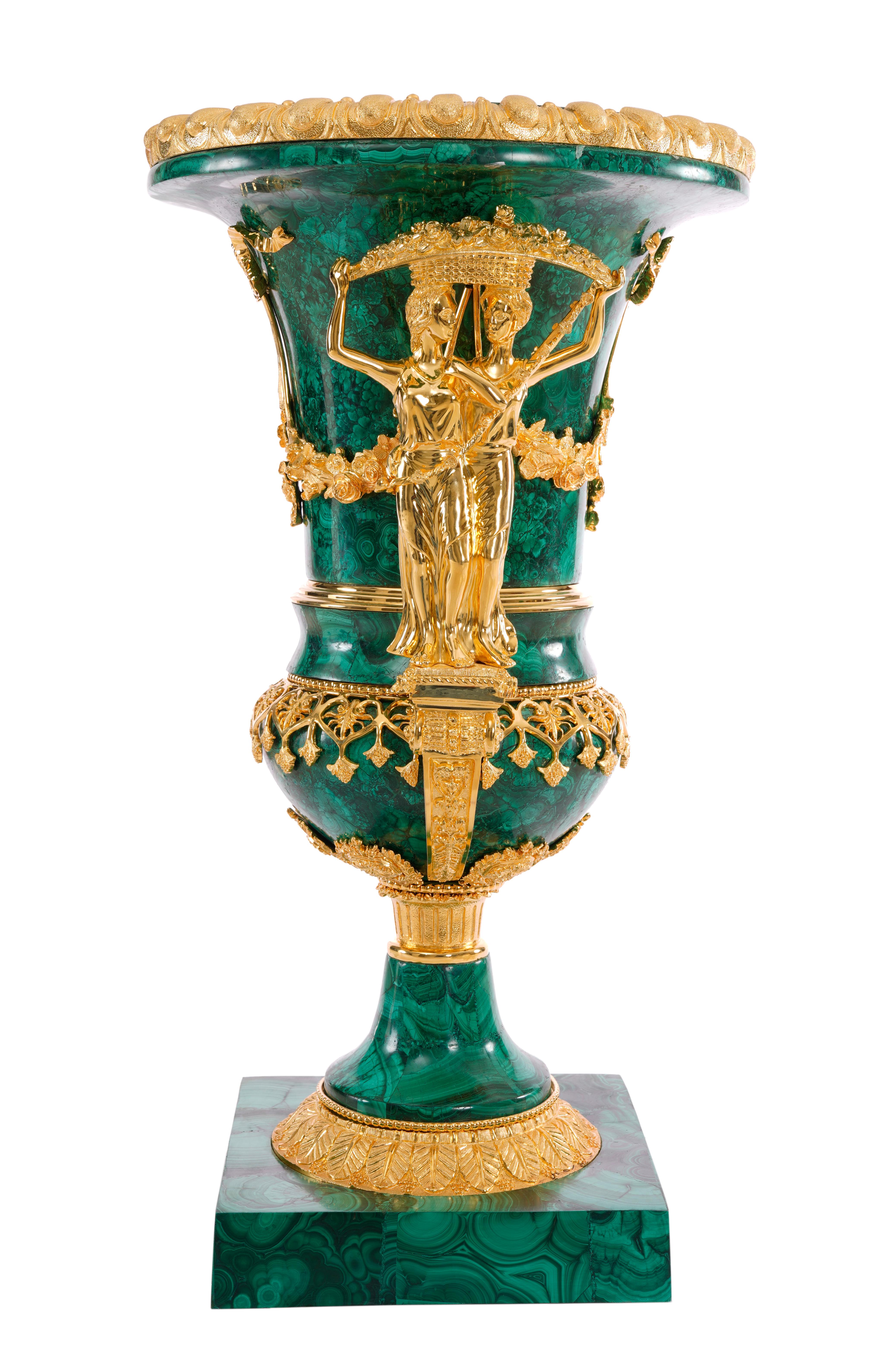 Pure luxury and uniqueness in this Malachite and Brass combination Vase. Malachite is a precious stone which is usually found in small quantities and is formed over thousands of years. The most striking property of the Malachite stone is its