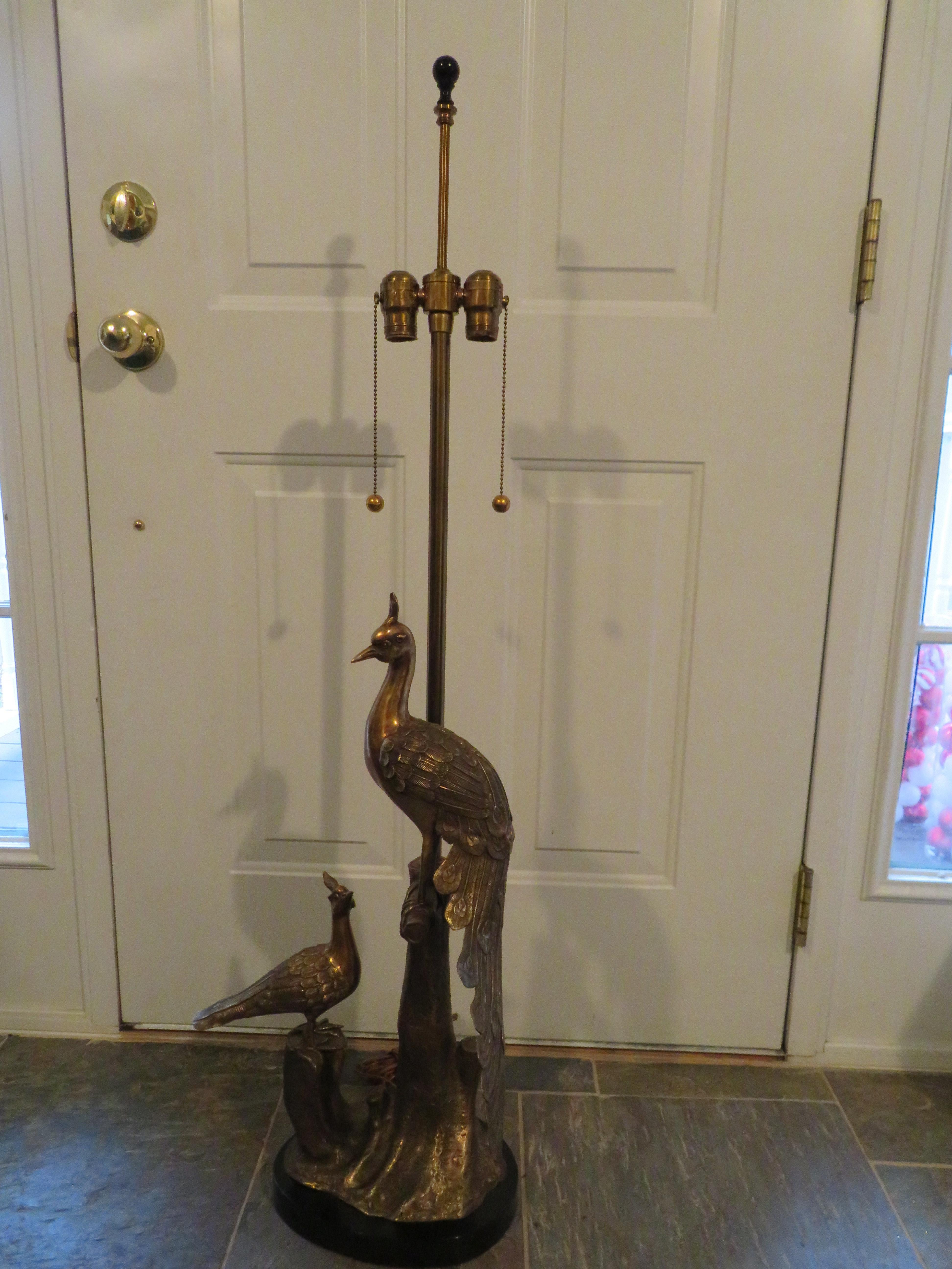 Gorgeous vintage brass Marbro table lamp depicting 2 peacocks sitting on a tree stump. We love the larger mother peacock watching over her baby who is lovingly looking up at her-so adorable! This table lamp is by the Markoff brothers of The Marbro