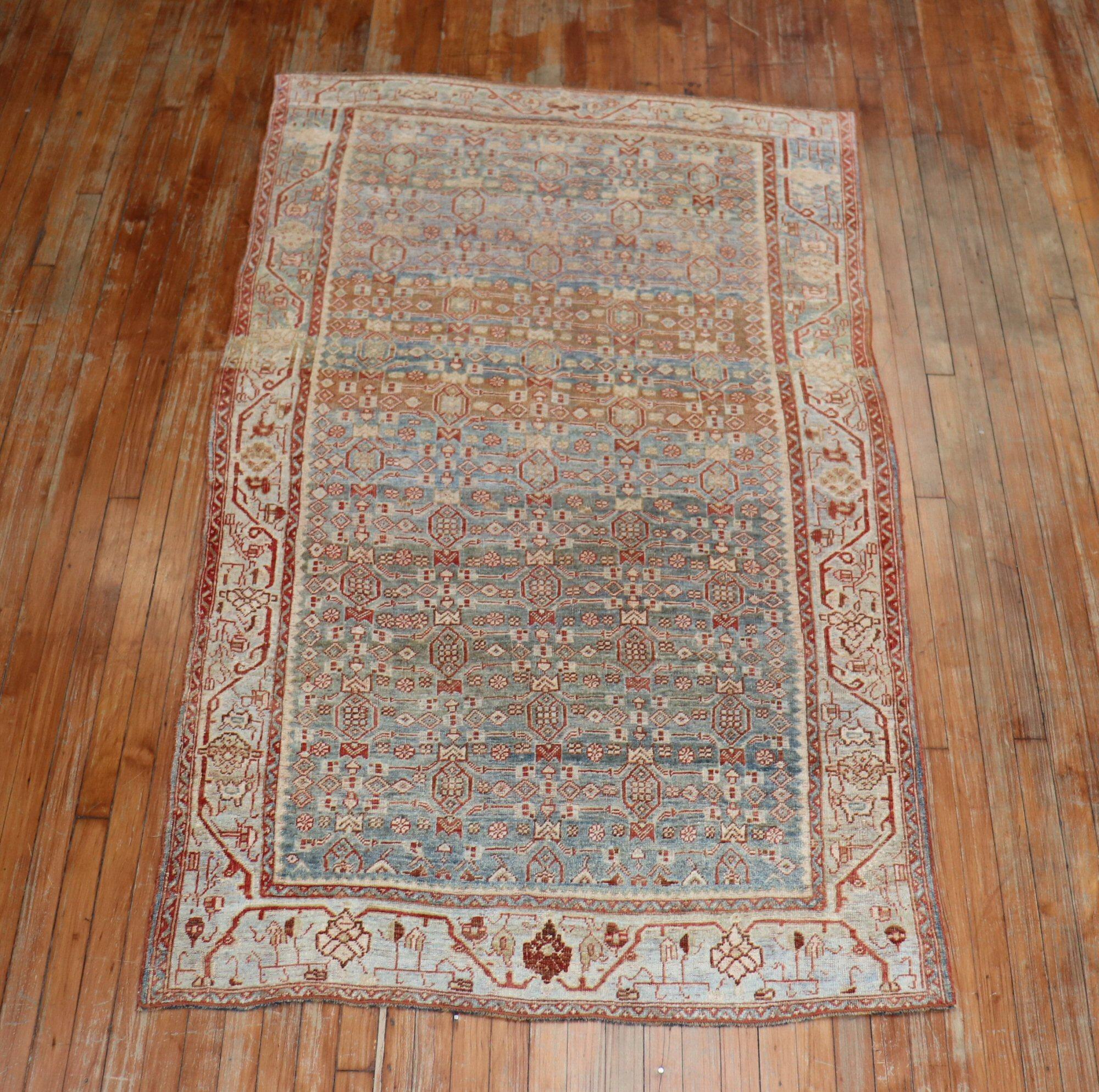 Masculine best describes this Persian Bidjar rug from the early 20th century with an all-over Herati design in dominant soft blue and red accents

Measures: 4'3