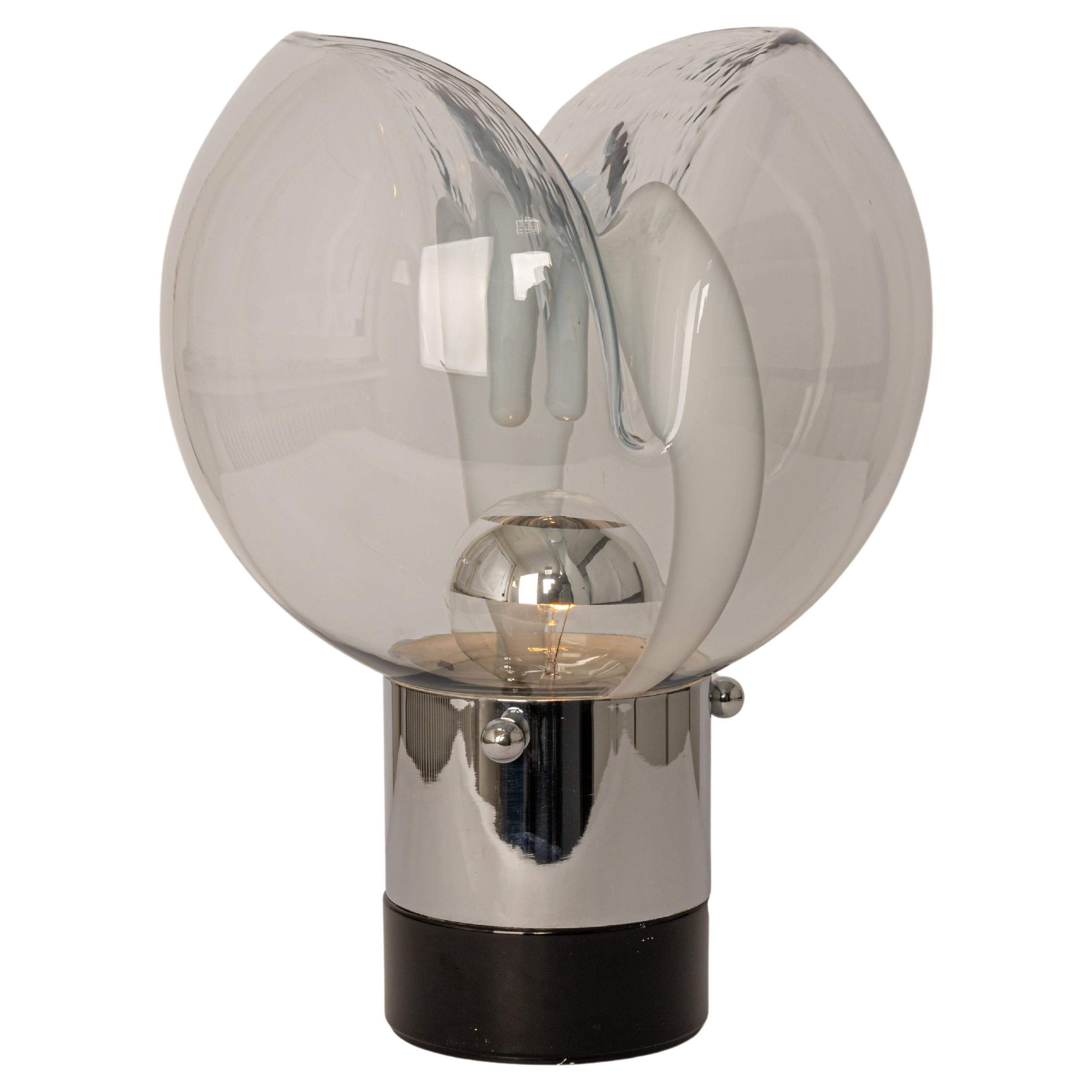 Wonderful mushroom table lamp by Peill & Putzler, Germany, 1970s. Made of a single piece.
Great glass body and its edgy quality contrast nicely with the smooth surface and shape of the mushroom. 

Singular, unique, and Huge Italian 