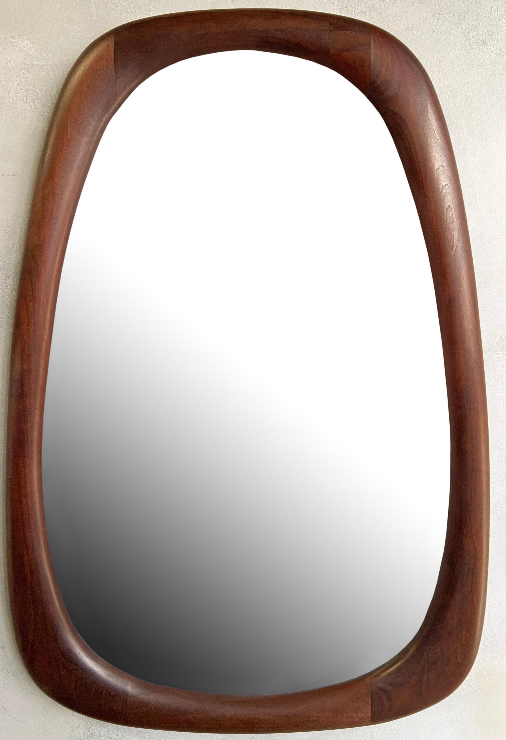 For your consideration is this beautifully sculpted mirror by Dean Santner. Master craftsman Dean Santner designs are part of the American Modern Craft movement along side Wendell Castle, George Nakashima, Phillip Powell and was part of the Bolinas