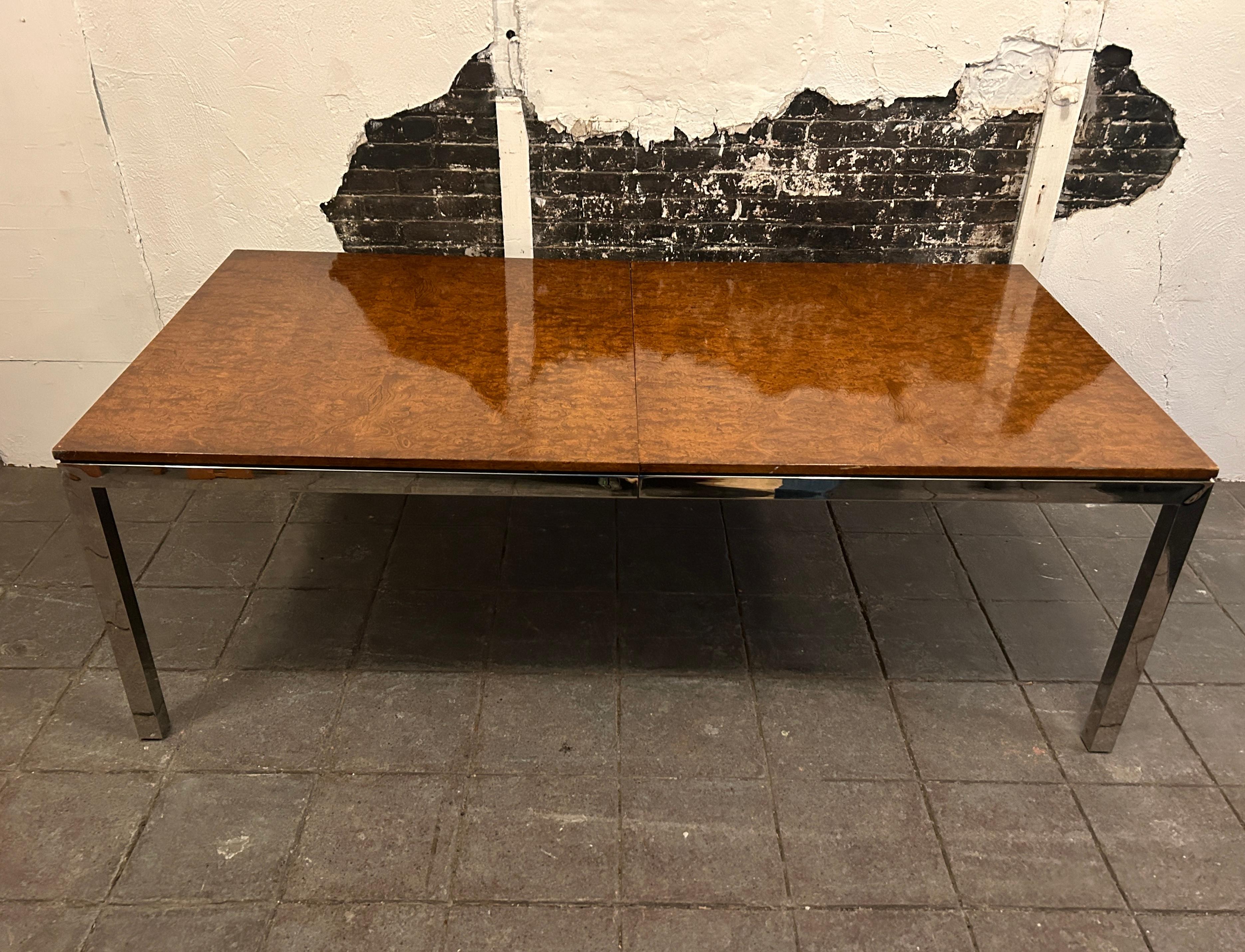 Beautiful mid century chrome dining table with burl top 2 leaves. Amazing burl top with square chrome tube frame parsons style table. Style of Milo Baughman. This table is very high quality with (2) leaves. The table is 42