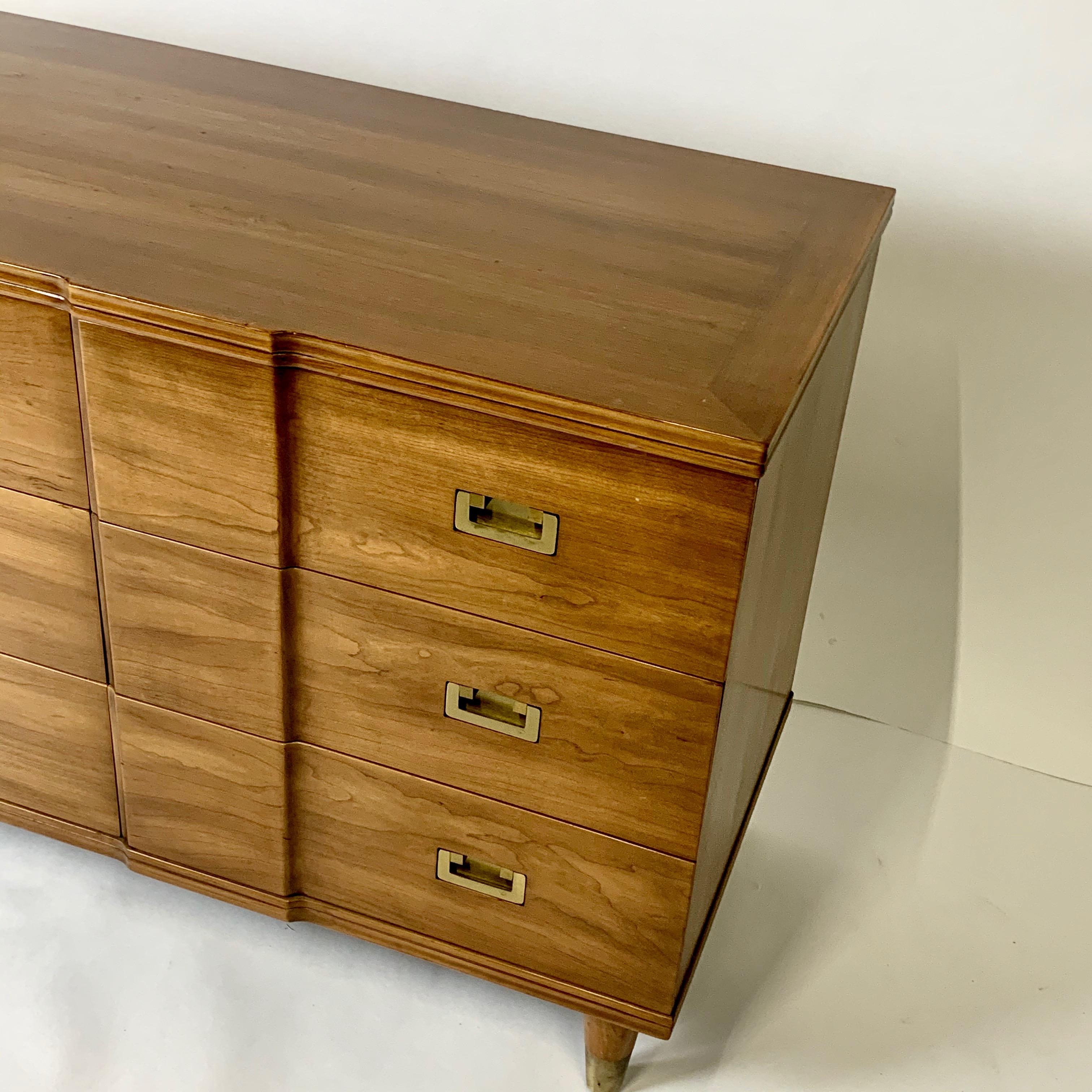 Stunningly elegant nine drawer dresser made by John Widdicomb. Solid maple construction with solid brass pulls and drawer inserts. A very handsome dresser in very nice original condition.