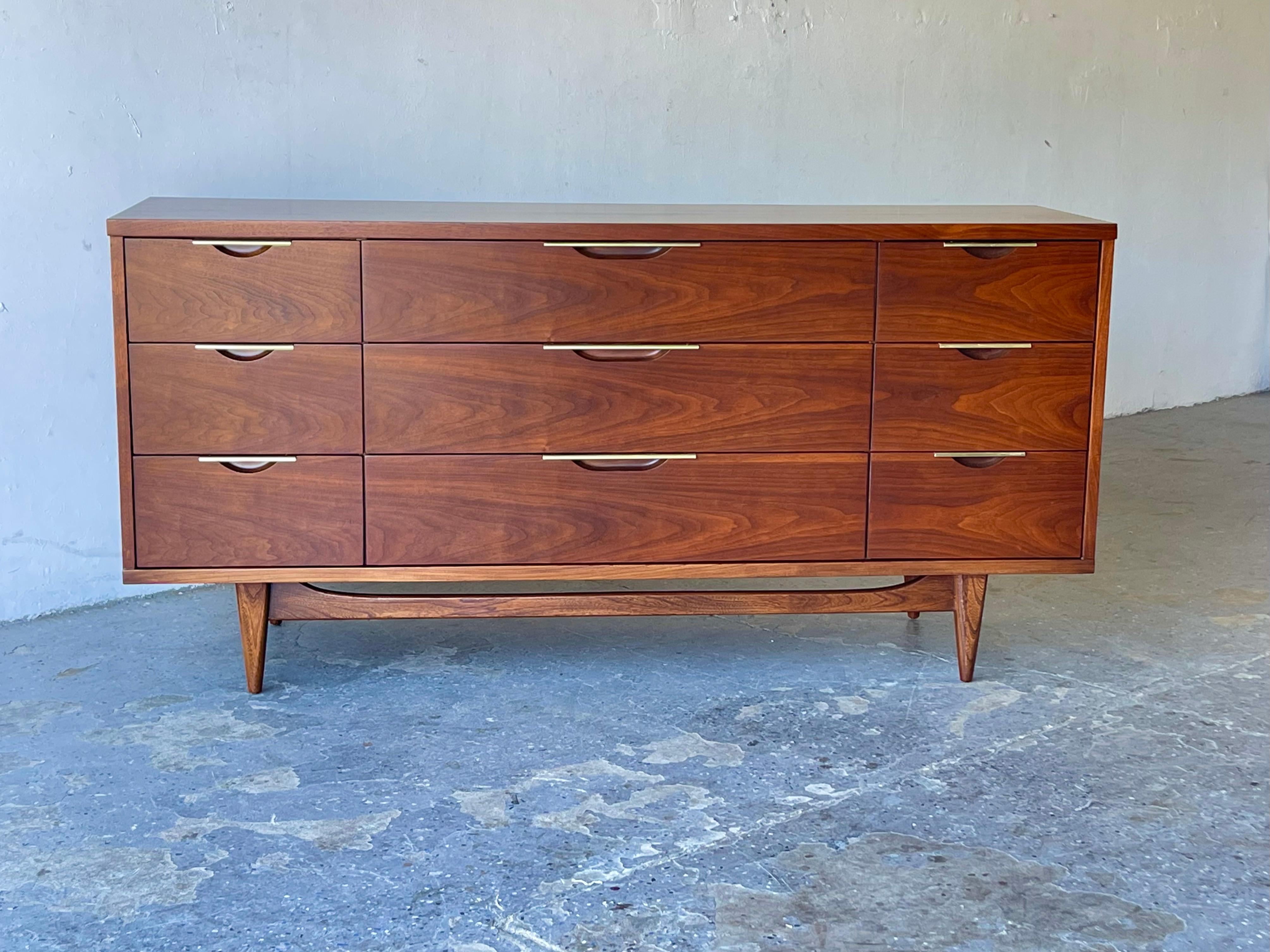 Modernist walnut and brass chest or drawers by Kent Coffey 