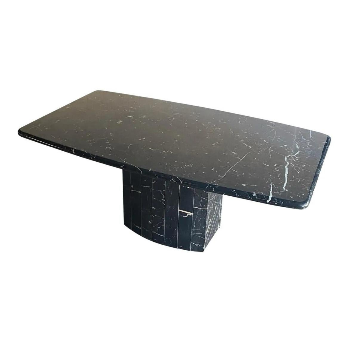 Stunning Mid-Century Modern Marquina black with white veins marble dining table with oval segmented base. Beautiful curved geometric designed shape similar to Willy Rizzo designs. Table top is 72” x 40” x 2” rounded edge profile. Table height 29”