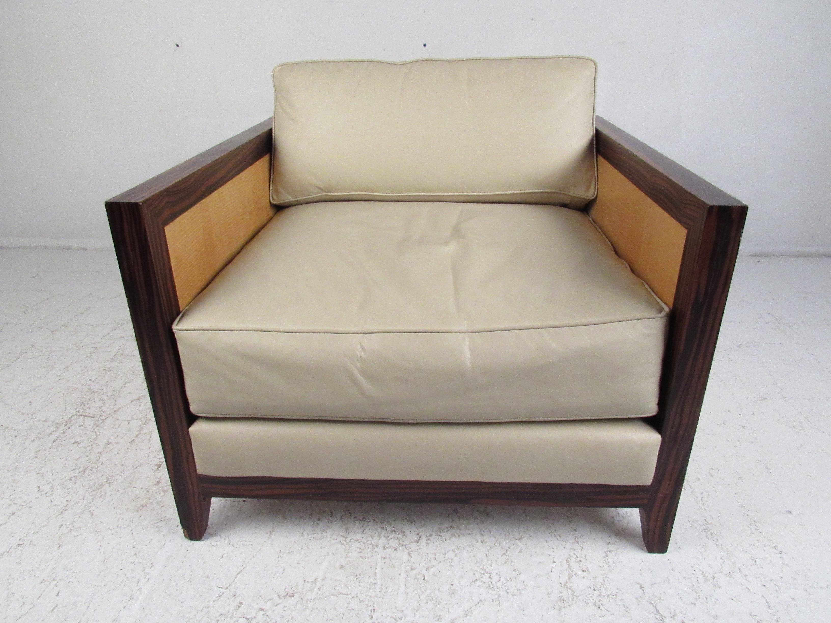 This beautiful vintage modern lounge chair features a cube shaped frame with two-tone wood, thick padded removable cushions and tapered legs. A well constructed chair by Interior Crafts; this Milo Baughman style armchair boasts an elegant rosewood