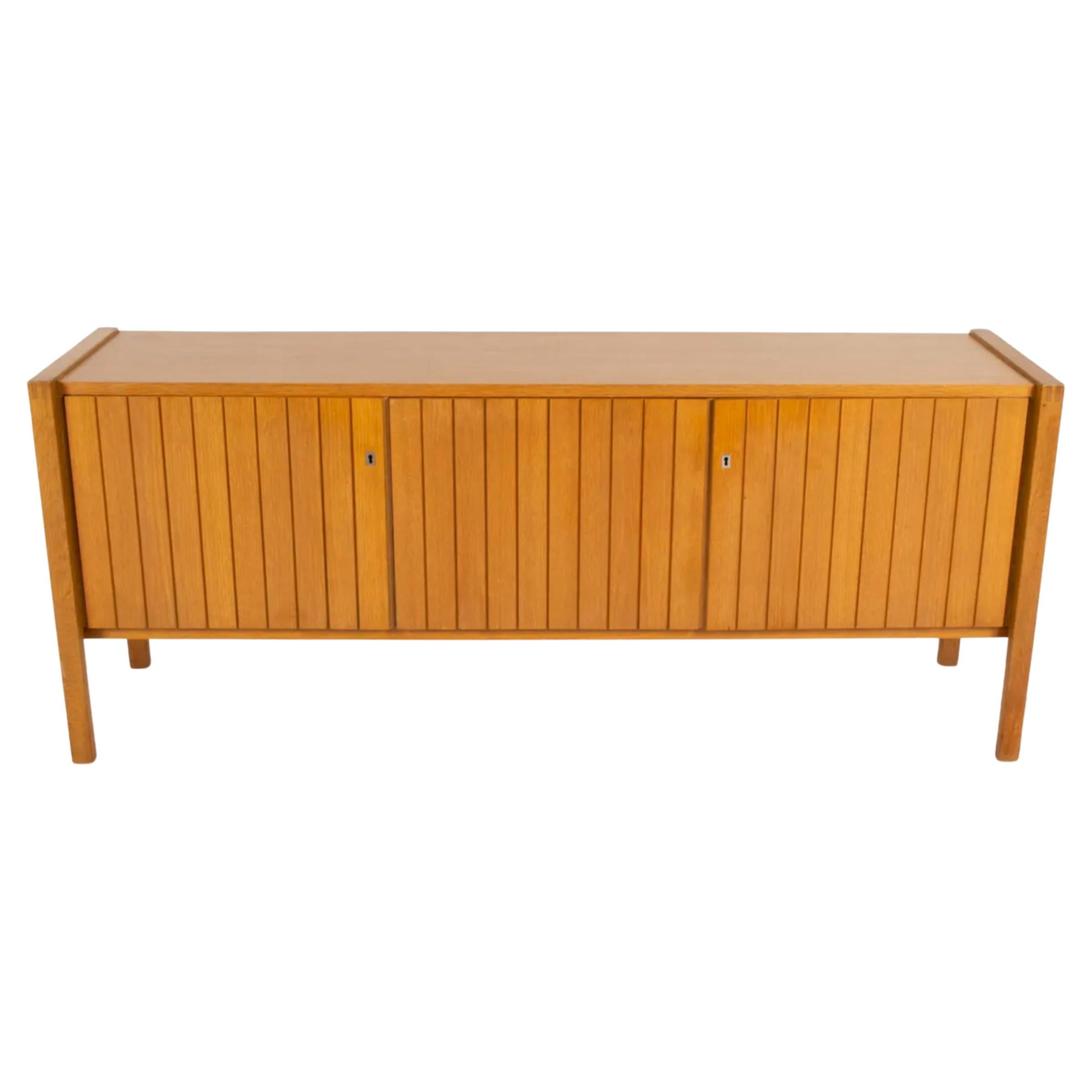 Stunning Mid Century modern German Oak Paneled Credenza 3 door with key In Good Condition For Sale In BROOKLYN, NY