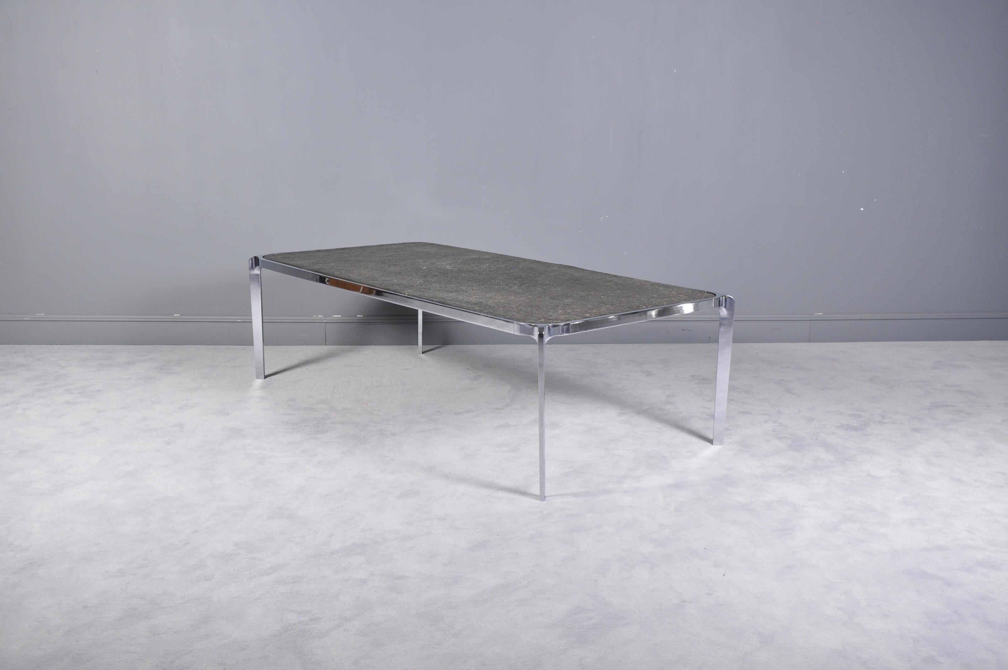 This gorgeous vintage modern coffee table features a rectangular granite top and a heavy chrome frame. This elegant vintage modern cocktail table makes the perfect addition to any home, business, or office.