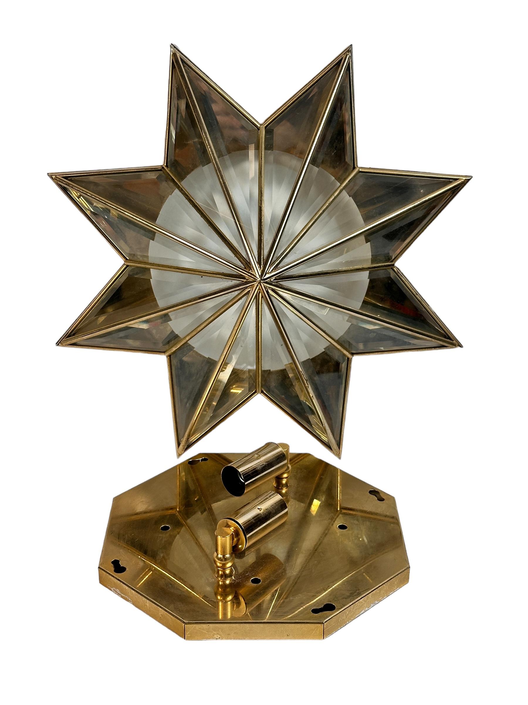 A beautiful flush mount or wall light, made in Germany in the 1960s. Made by Müller Leuchten in Munich. The fixture requires two European E14 candelabra bulbs, each bulb up to 40 watts. It can also hang as a wall fixture or sconce. The star