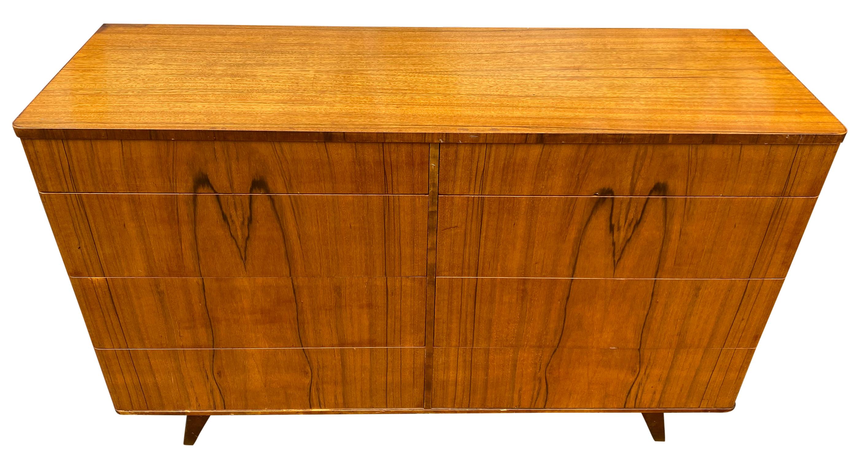 Stunning midcentury 8-drawer rosewood veneer dresser made in Sweden. Beautiful early deco style midcentury dresser. Beautiful blonde wood drawer construction all clean and slide smooth. Great Patina with a stunning rosewood veneer front drawers and