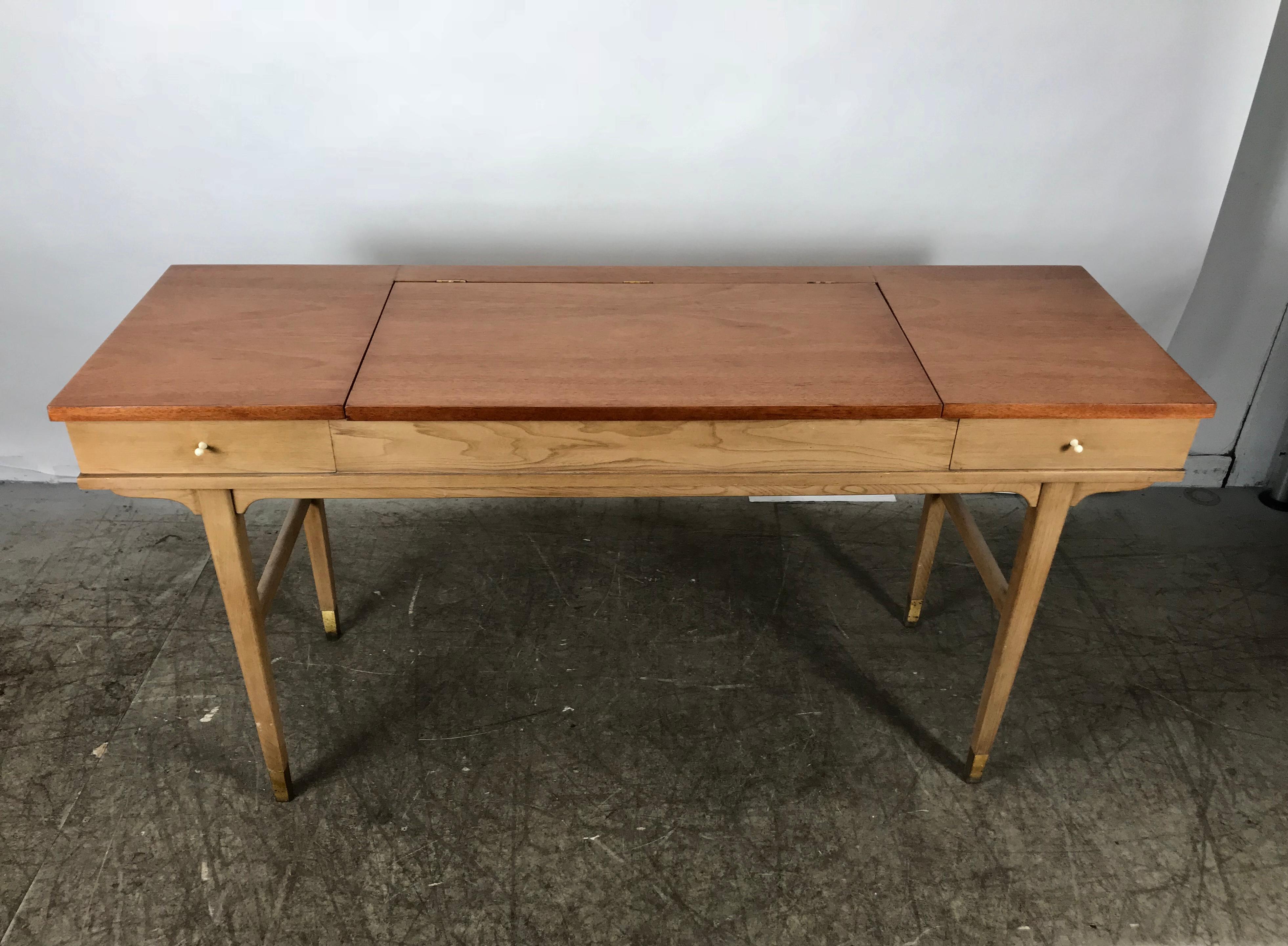 Stunning midcentury desk or vanity, elegant modernist design, extremely versatile, use as desk, vanity with divided storage cubbies and mirror, Classic console or hall table, recently restored top, two-tone finish with modern porcelain pulls,