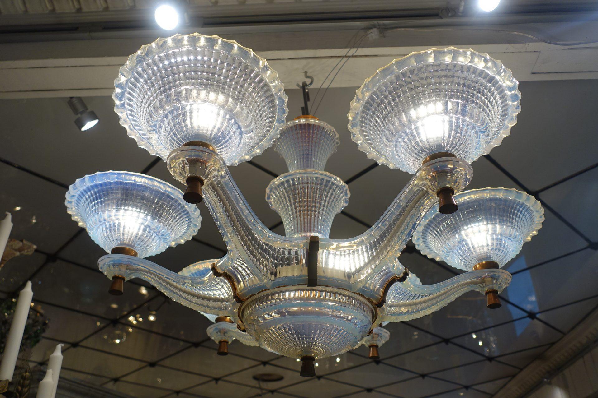 Wonderful and spectacular vintage French Ezam ceiling lamp. Semi transparent opaque milky white glass. This chandelier is a true 1950s gem, with 6 arms holding 6 cupped light sources. Rows of charming beading. A surreal almost organic nautical look.