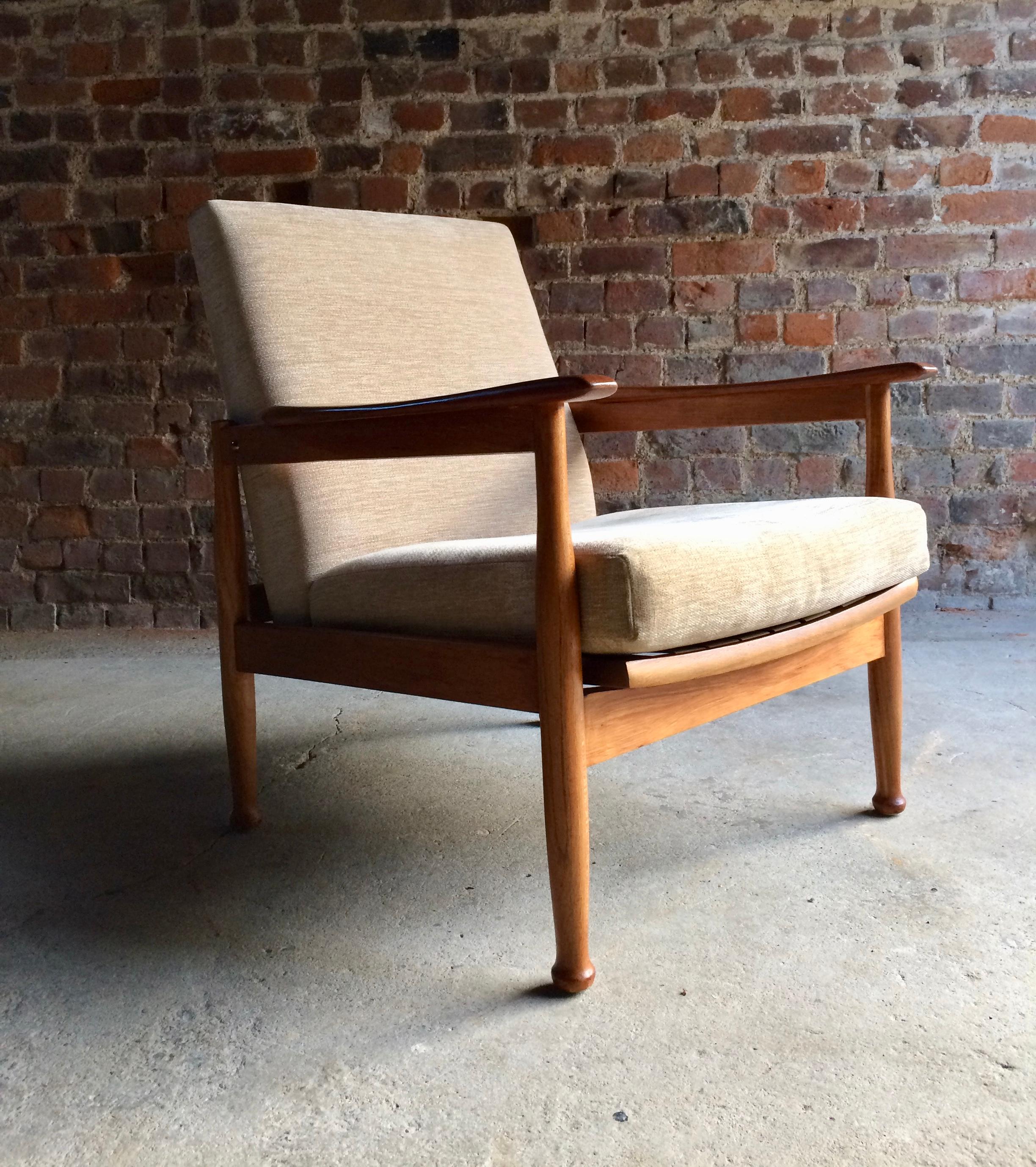 Midcentury Guy Rogers Manhattan teak armchair, circa 1960s, beautiful teak framed armchair that has been re upholstered in a cream velour fabric, three stage reclining action, offered in superb condition.
 
Dimensions:
 
Height: 31” inches /