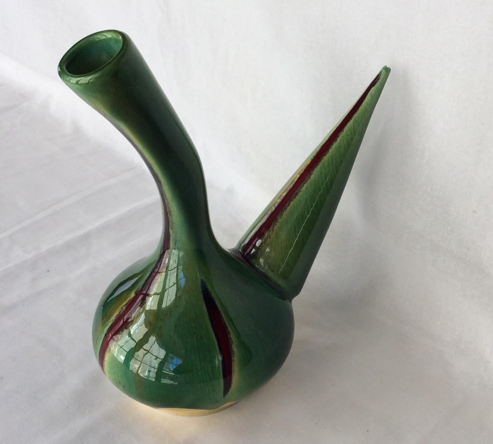 Stunning midcentury decorative vessel resembling centuries old Greek or Roman oil jars. This interesting designed piece is from Perpignan, France. 

The brilliant green, yellow, ruby red and black glazed ceramic is very pleasing to the