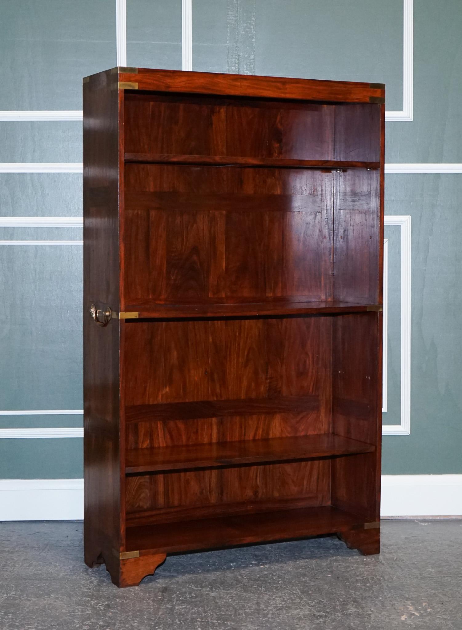 
We are delighted to present this Stunning Military Campaign Open Bookcase.

A solid and very well-made piece, in the military campaign style, the brass fittings are all around the corners and the original brass handles are on the sides.
The top and