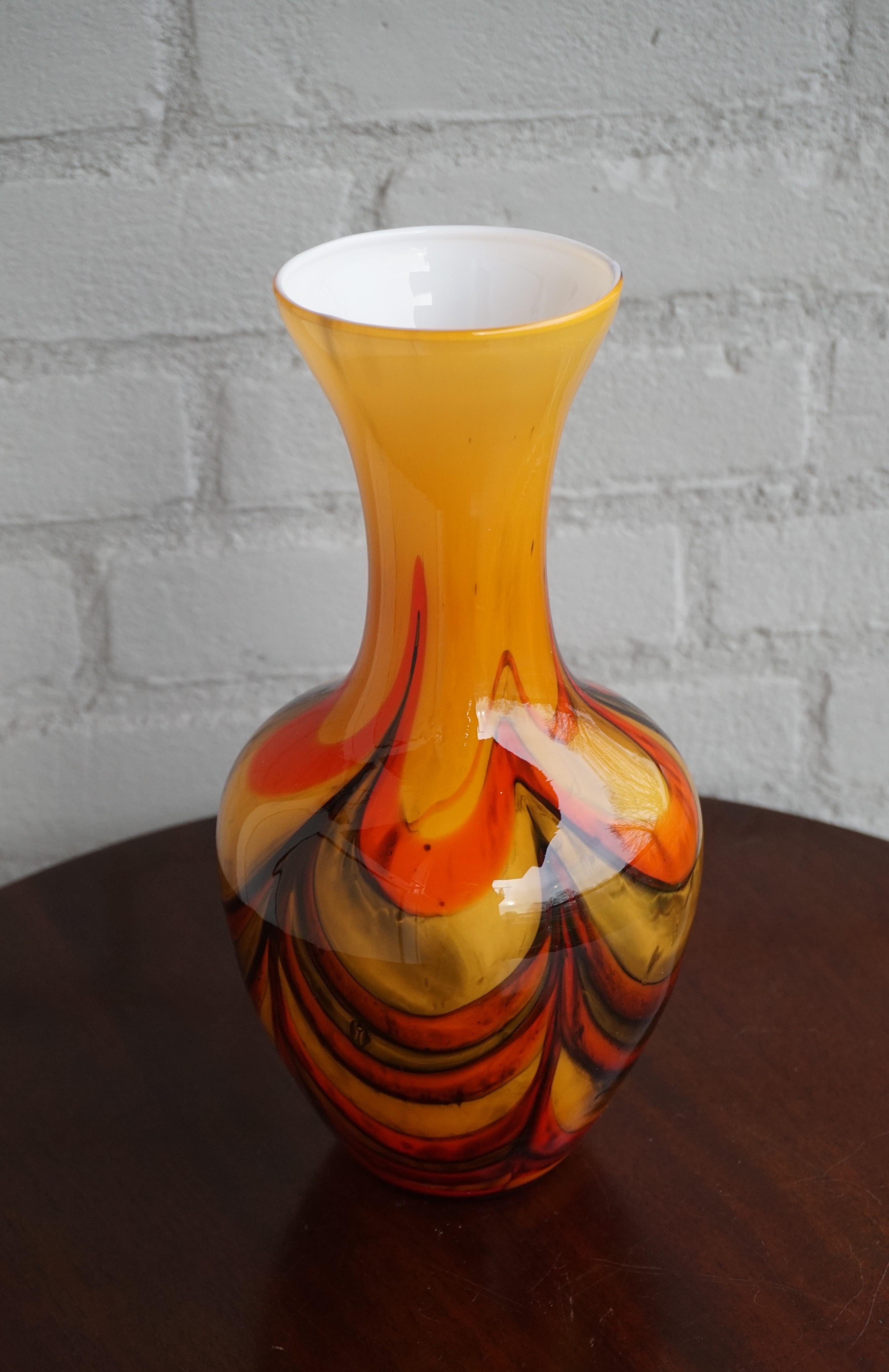 Beautiful art glass vase from the midcentury era.

Looking at this remarkable vase one might think that it was never made to be used. It is so much more than your average vase that using it would probably only take away the beauty of this mouthblown