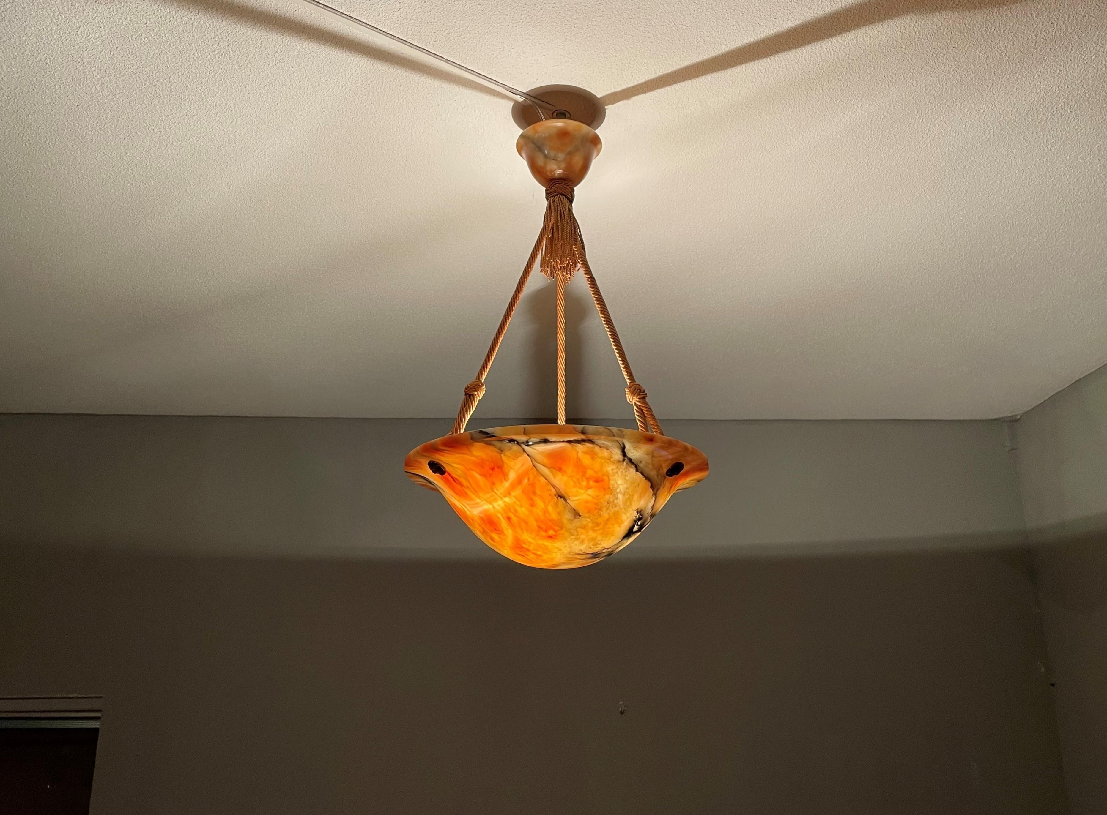 Great shape and warmest color alabaster light with matching canopy.

If you are looking for a truly beautiful, great quality and all original condition alabaster pendant then this striking specimen could be the one or you. This regular size, but