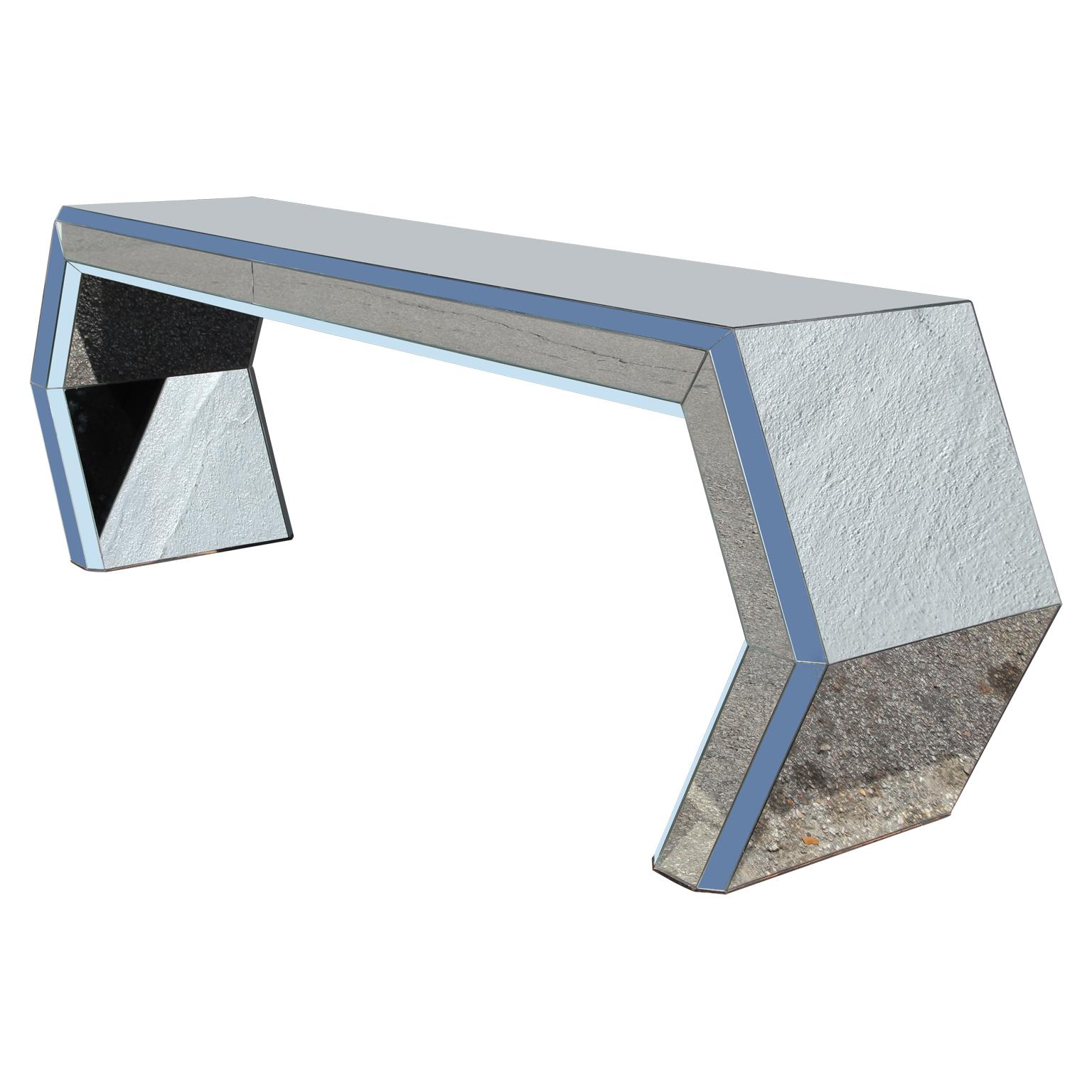 Stunning modern angular geometric mirror entry console table. Photos have been edited to remove glare. The mirror color is silver. There is one small flaw on inside of one leg- no noticeable. Normal wear on the surface with light wear overall in