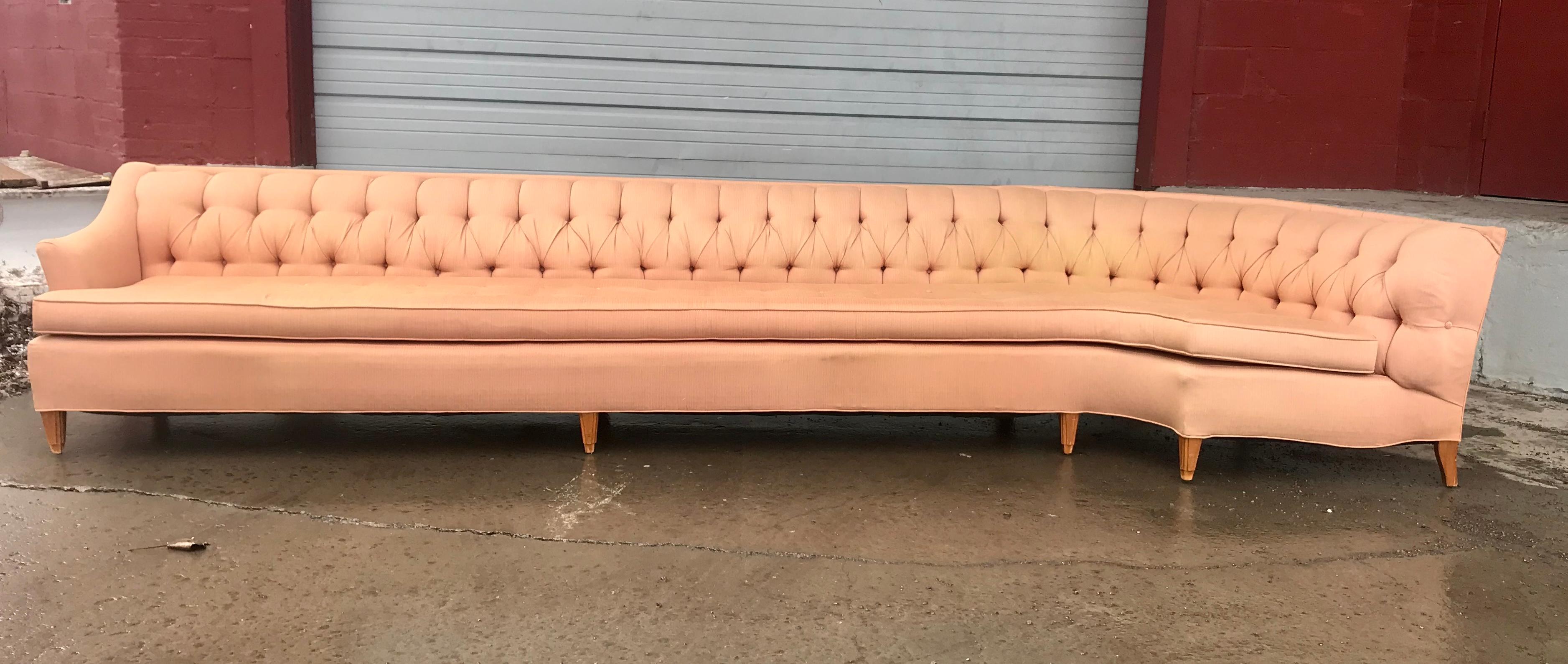 Stunning tufted 12 foot sofa, showstopper!, Custom built in the 1960s, amazing quality and construction, retains original fabric, some fading and missing buttons to bottom cushion, free of rips, tears, odor stains etc. Unusual leg design, original