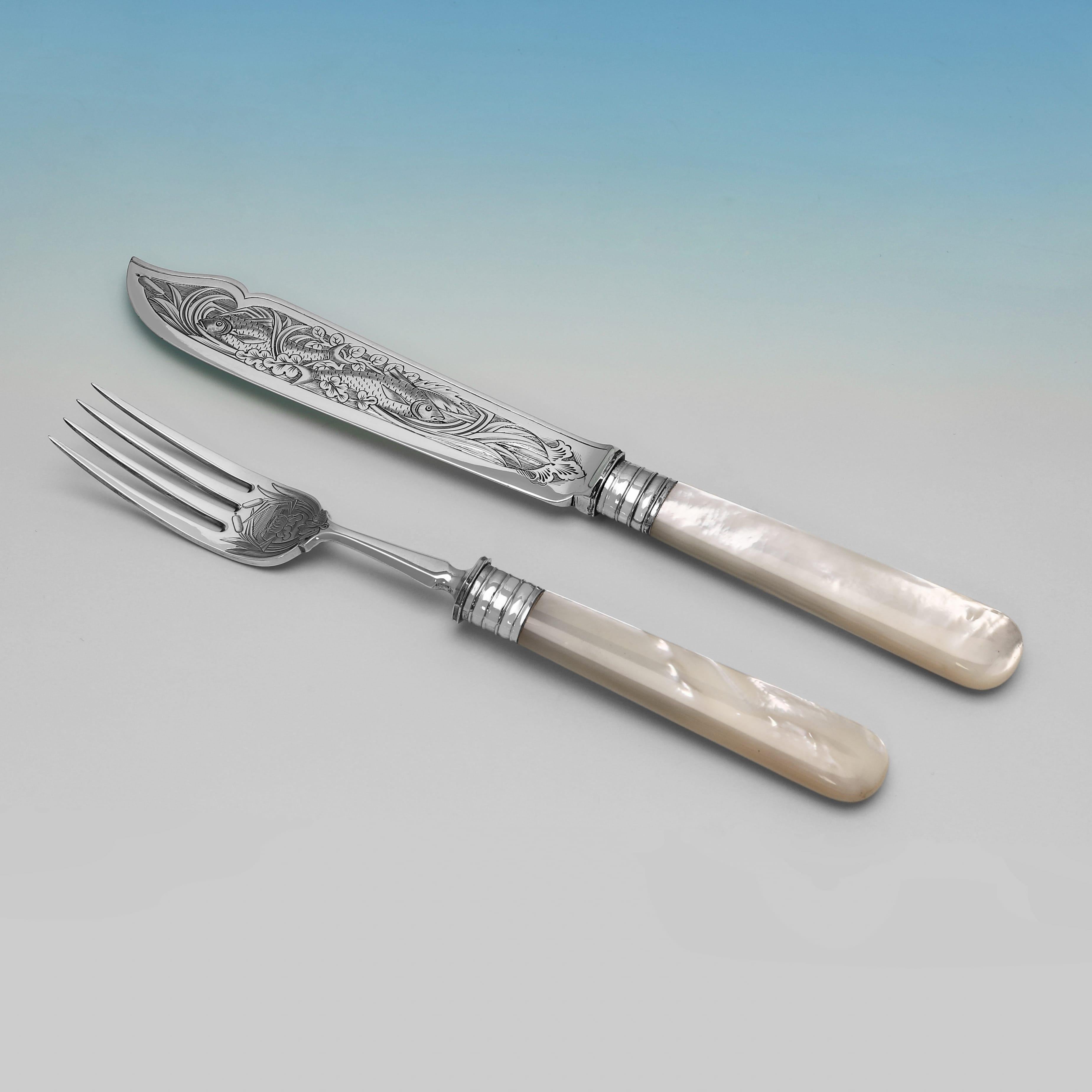 Hallmarked in Birmingham in 1881 by Elkington & Co., this very attractive set of Victorian Antique Sterling Silver & Mother of Pearl Fish Eaters and Serving Pieces, is presented in it's original box, and comprises 12 pairs of fish knives and forks,