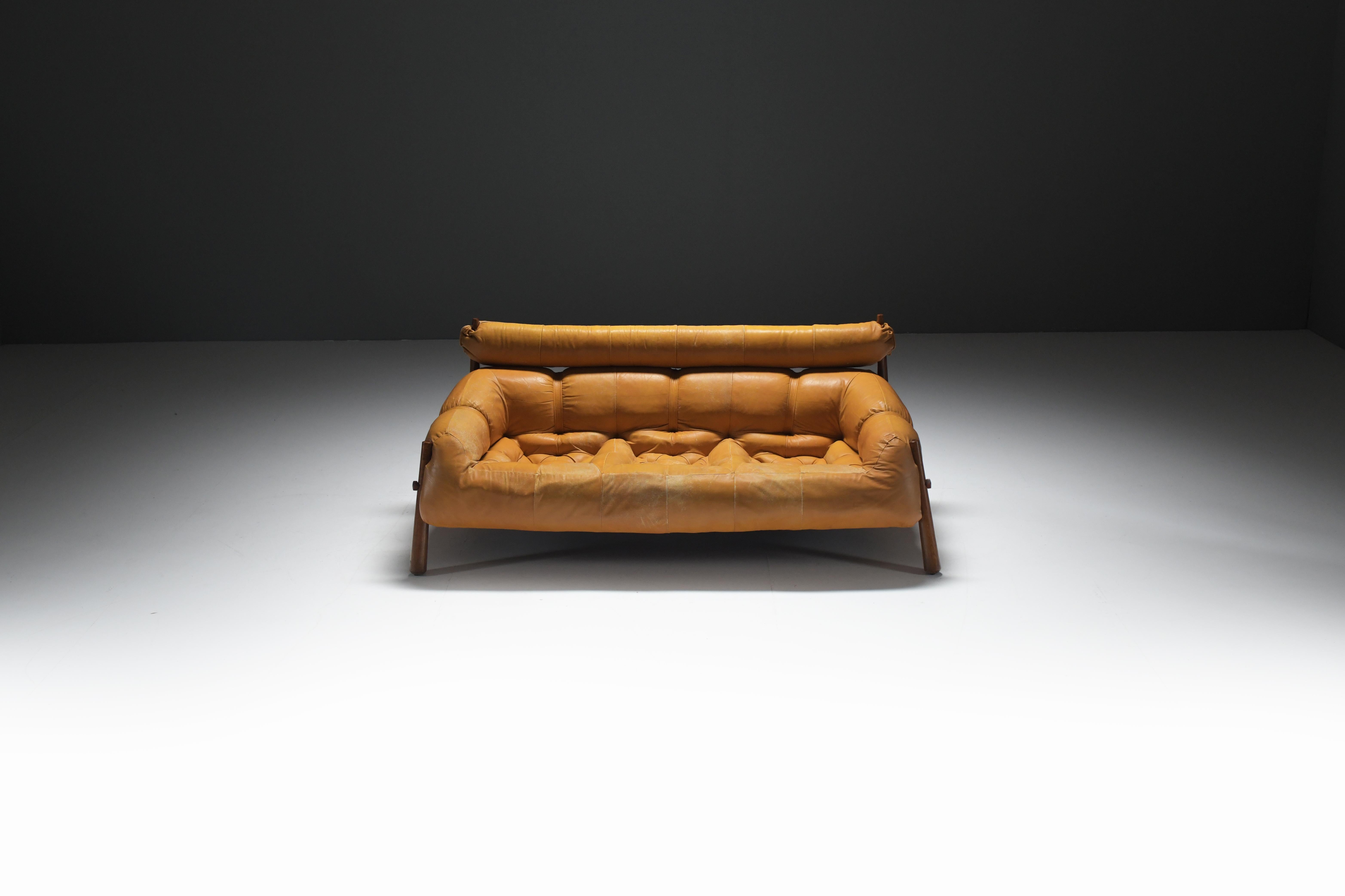 Very nice vintage MP-81 sofa set exude comfort and sophistication. The supportive frame envelops you in a gentle embrace as you sink back and unwind. A raised, tubular headrest, distinct from the seat, provides soothing support for your head and