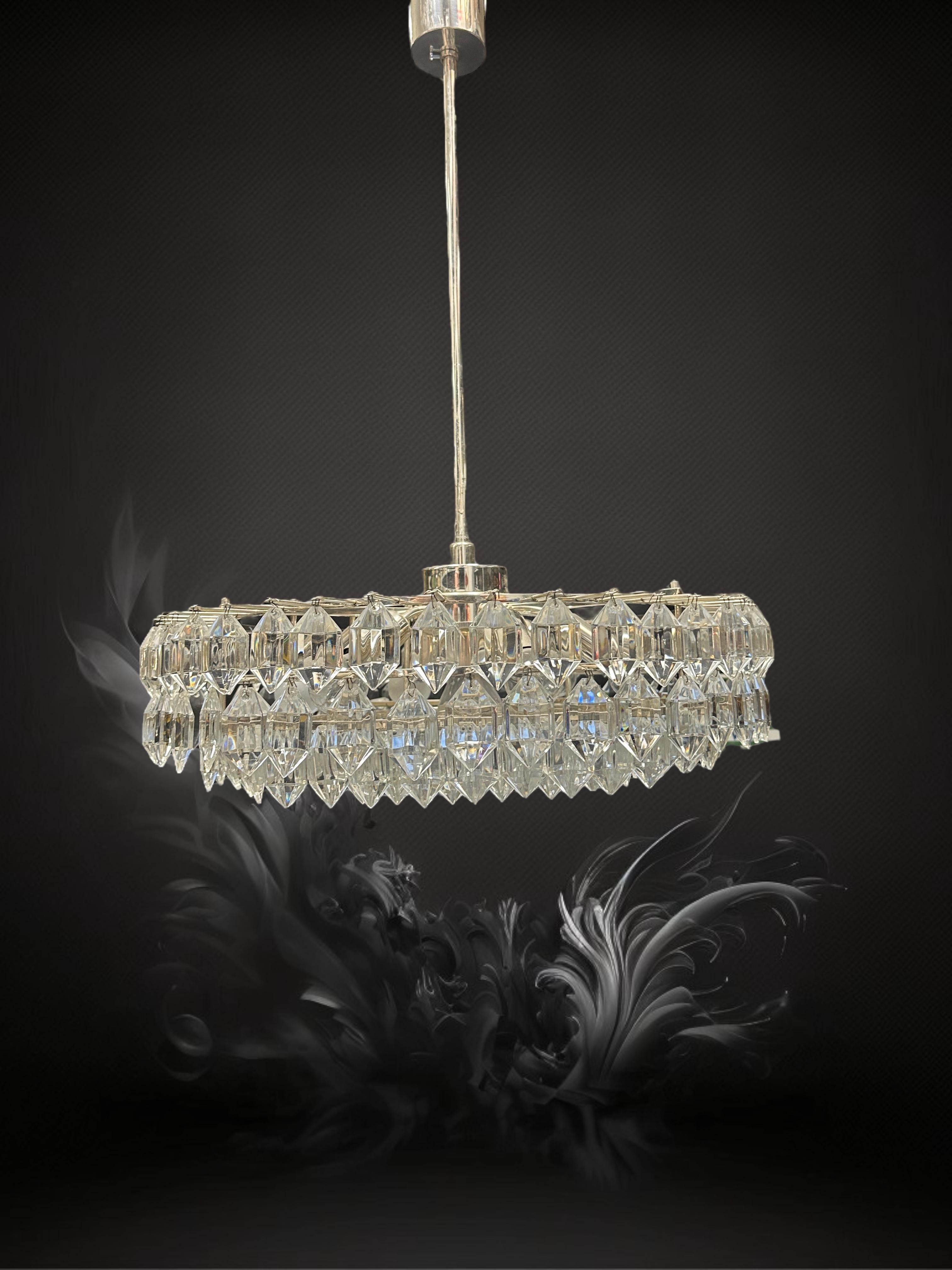Beautiful chandelier designed by Prof. Friedl Bakalowits for Bakalowits & Söhne, Vienna Austria. This light fixture is made of metal, chrome and lovely elements of crystal glass - gorgeous Austrian lamp with crystal glass and chrome, in beautiful