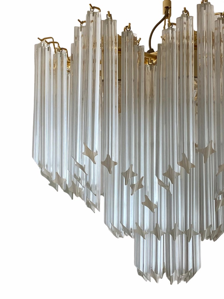 Stunning exceptional large Murano glass chandelier. Made in Italy, circa 1980s. The Chandelier requires nine European E14 candelabra bulbs, each up to 60 watts. It is a real treasure and gives any room a beautiful ambience. Light bulbs shown in the