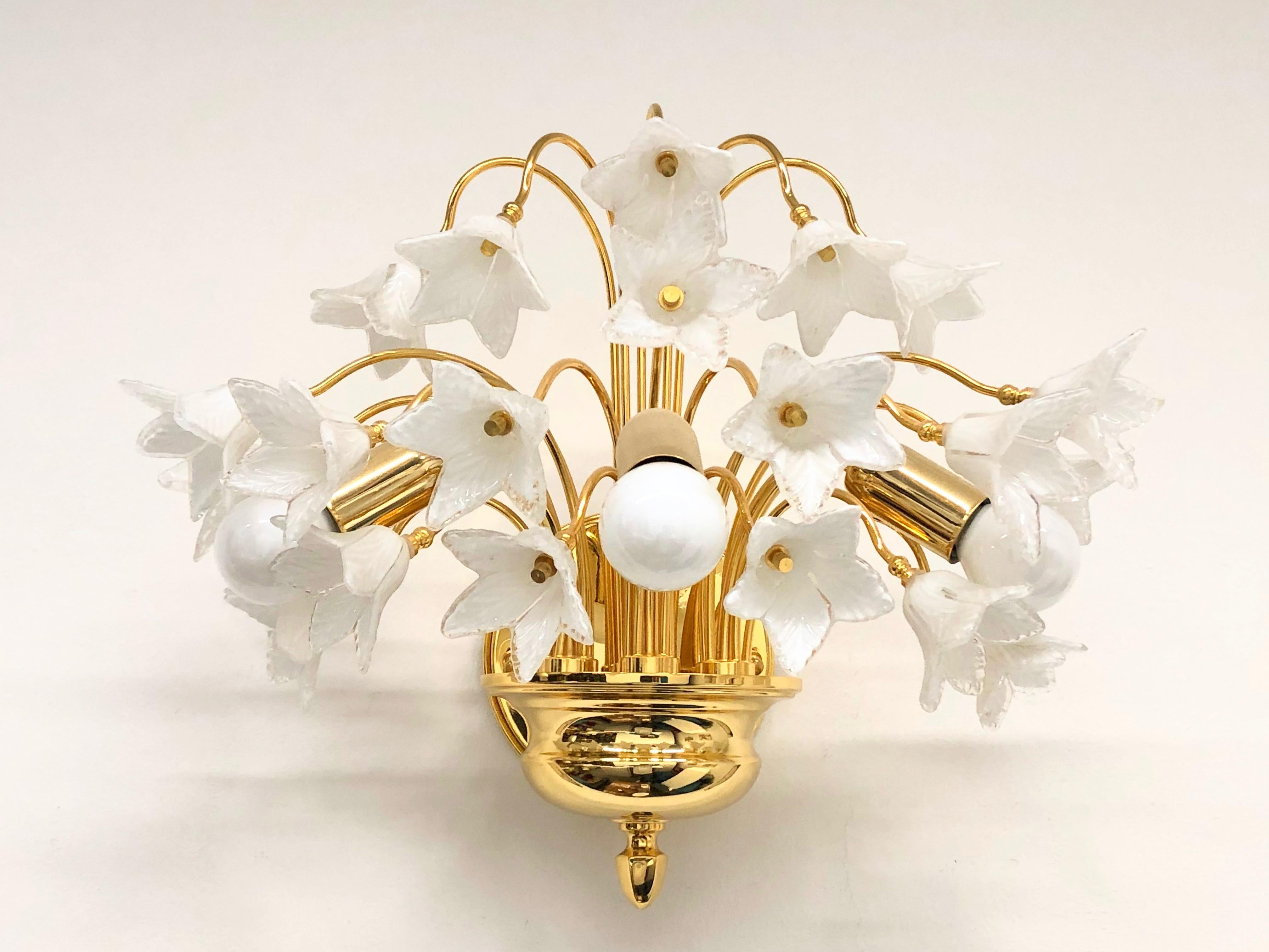 This Hollywood Regency style sconce is made of Murano glass flowers, on a gold plated frame, it has three arms with bulb holders. The fixture requires three European E14 candelabra bulbs, each bulb up to 40 watts. Bulbs are not included in this