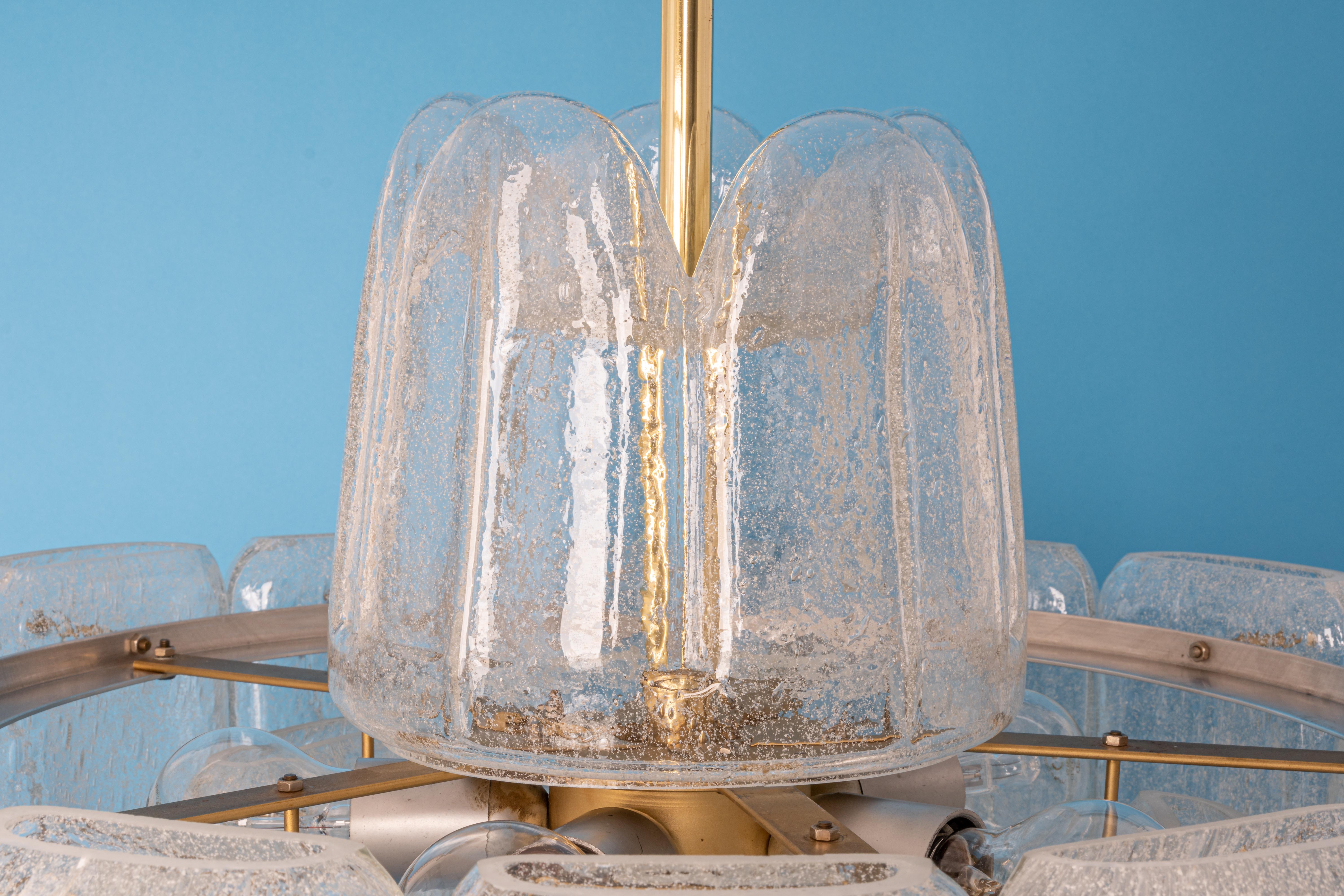 Fantastic big midcentury chandelier by Doria, Germany, manufactured circa 1960-1969. 10 Murano glass suspended from the fixture.

High quality and in perfect condition. Cleaned, well-wired and ready to use. 

The fixture requires 5 Standard
