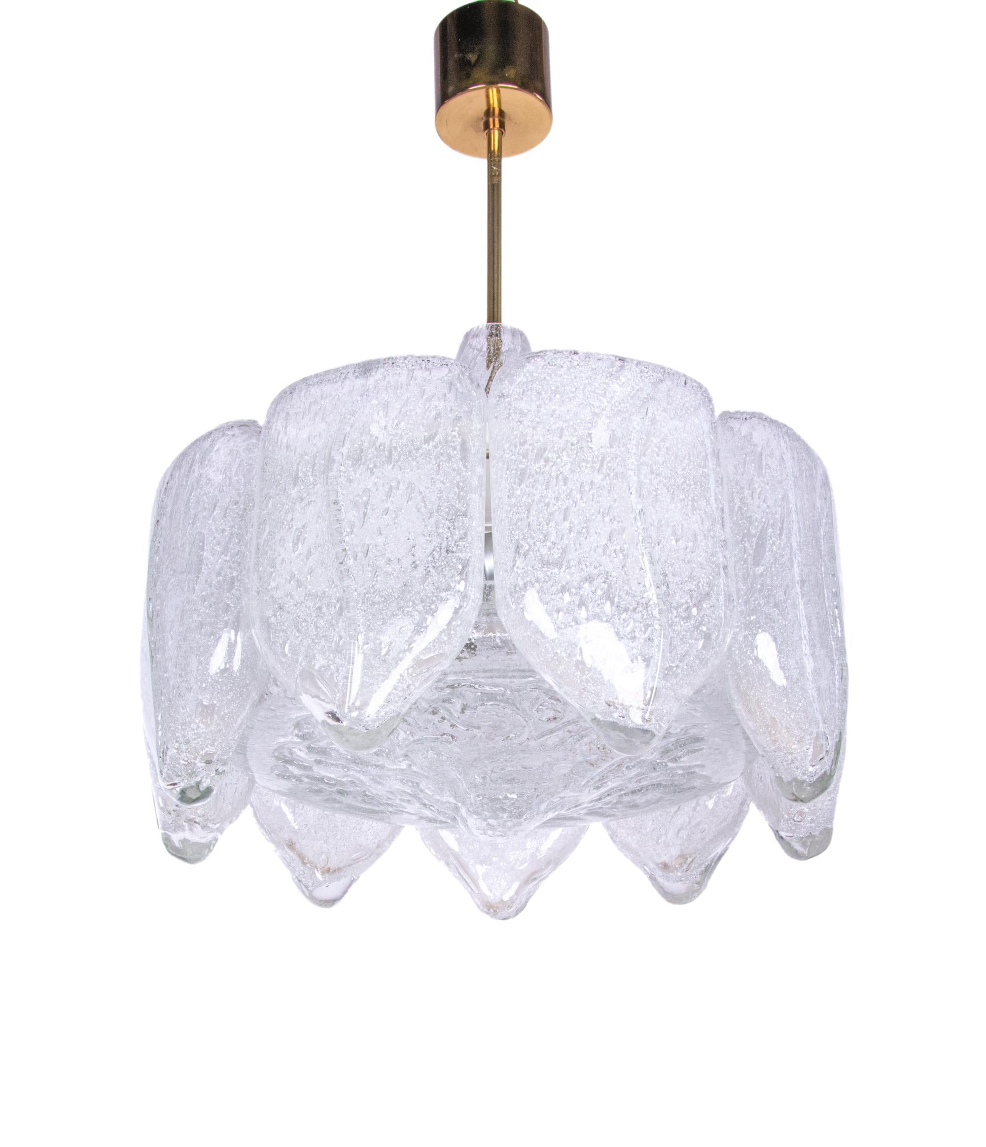 Stunning chandelier with Murano glass tubes on a brass frame. Chandelier illuminates beautifully and offers a lot of light. Hanging glass resembles melting icicles. Gem from the time. With this light you make a clear statement in your interior