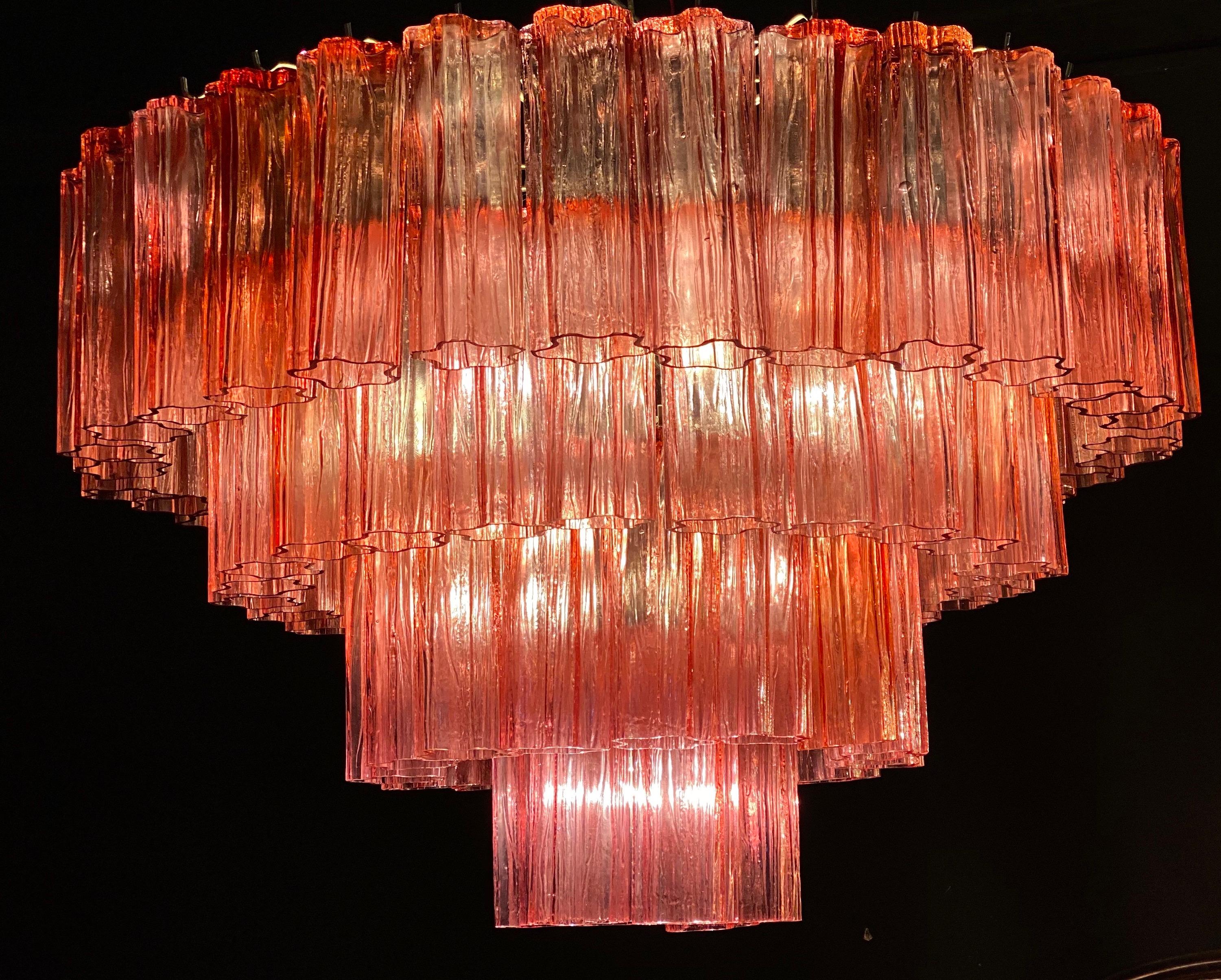 Fabulous chandelier with rare stunning fuchsia red color precious Murano glasses.
Each chandelier with 80 glass blown elements supported by a chrome frame. With a light on the color of the glasses turn in a magic light effect with the red