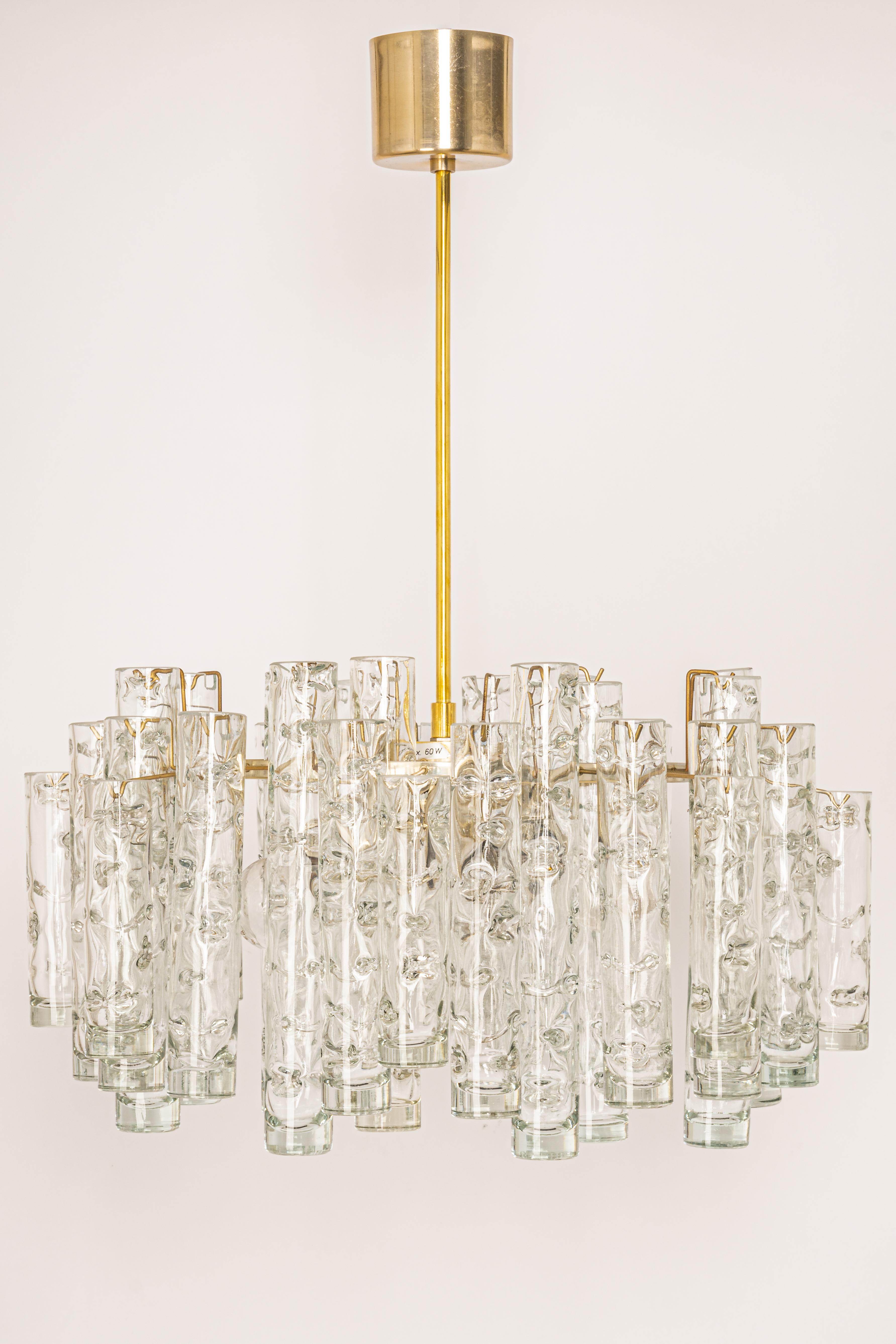 Fantastic mid-century chandelier by Doria, Germany, manufactured circa 1960-1969. A lot of Murano glass cylinders suspended from the fixture.

Heavy quality and in very good condition. Cleaned, well-wired, and ready to use.

The fixture requires