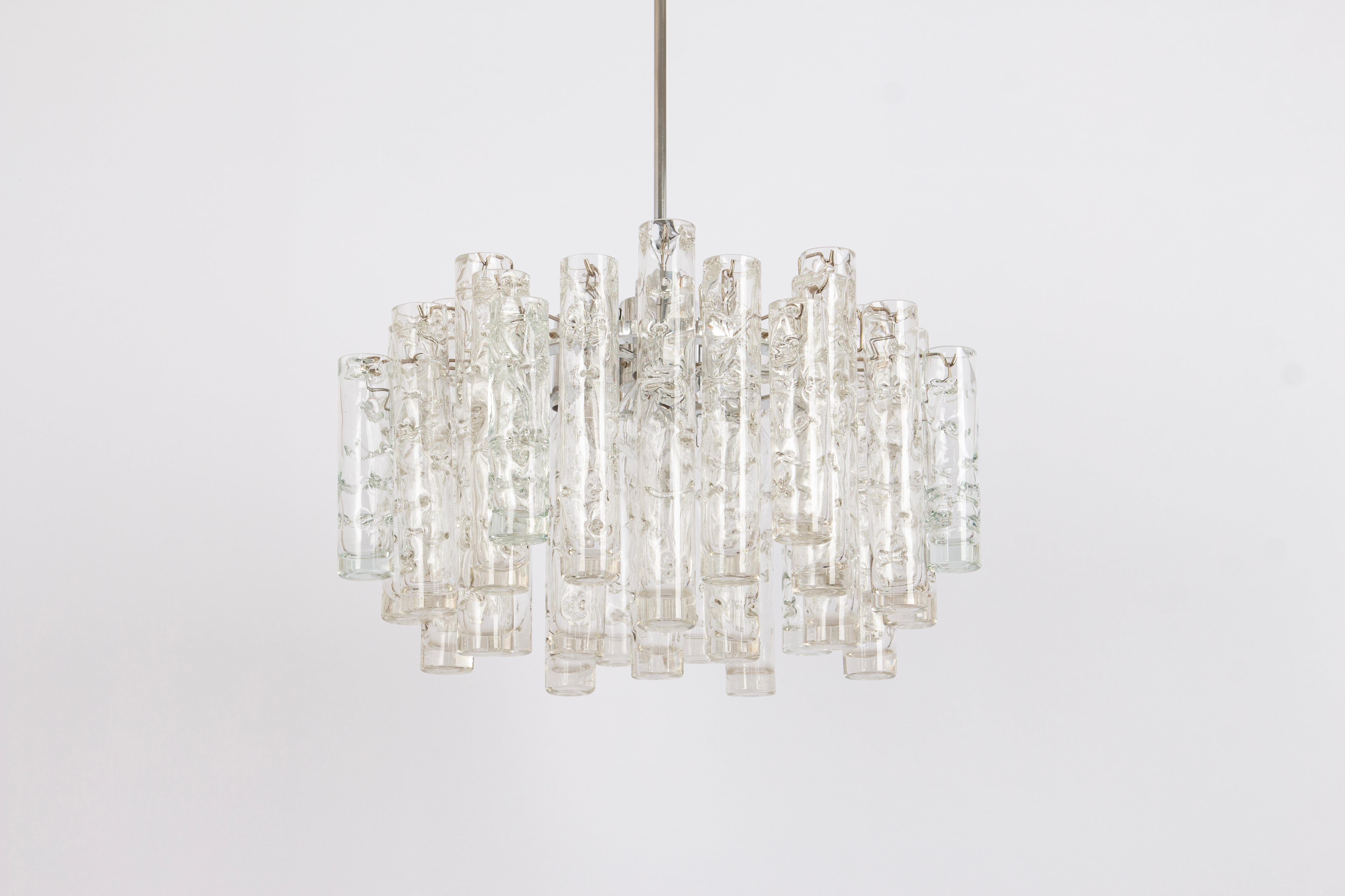 Fantastic mid-century chandelier by Doria, Germany, manufactured circa 1960-1969. A lot of Murano glass cylinders suspended from the fixture.

Heavy quality and in very good condition. Cleaned, well-wired, and ready to use.

The fixture requires 3 x