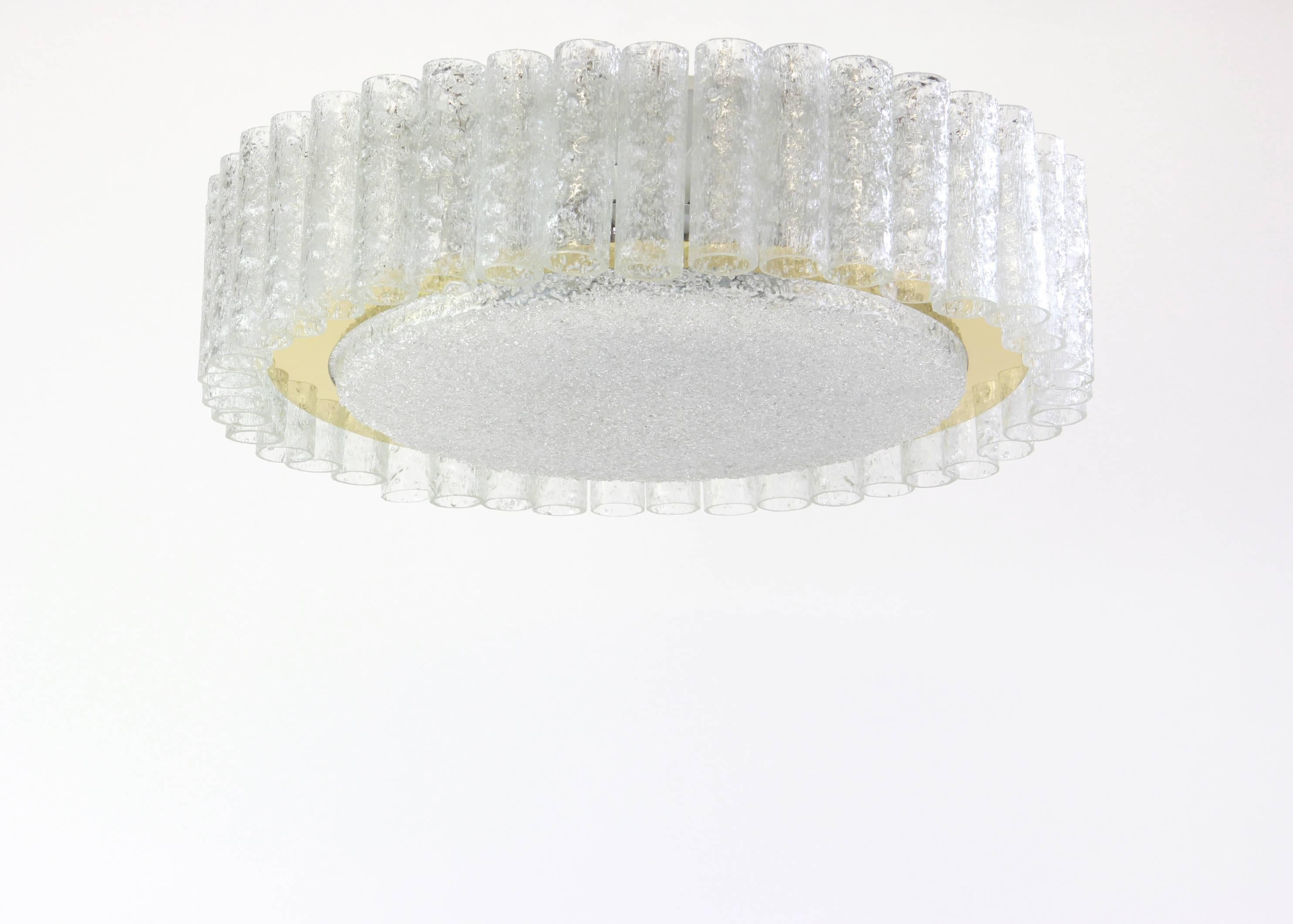 Fantastic big midcentury chandelier by Doria, Germany, manufactured, circa 1960-1969. Many Murano glass cylinders suspended from the fixture.

High quality and in very good condition. Cleaned, well-wired and ready to use. 

The fixture requires