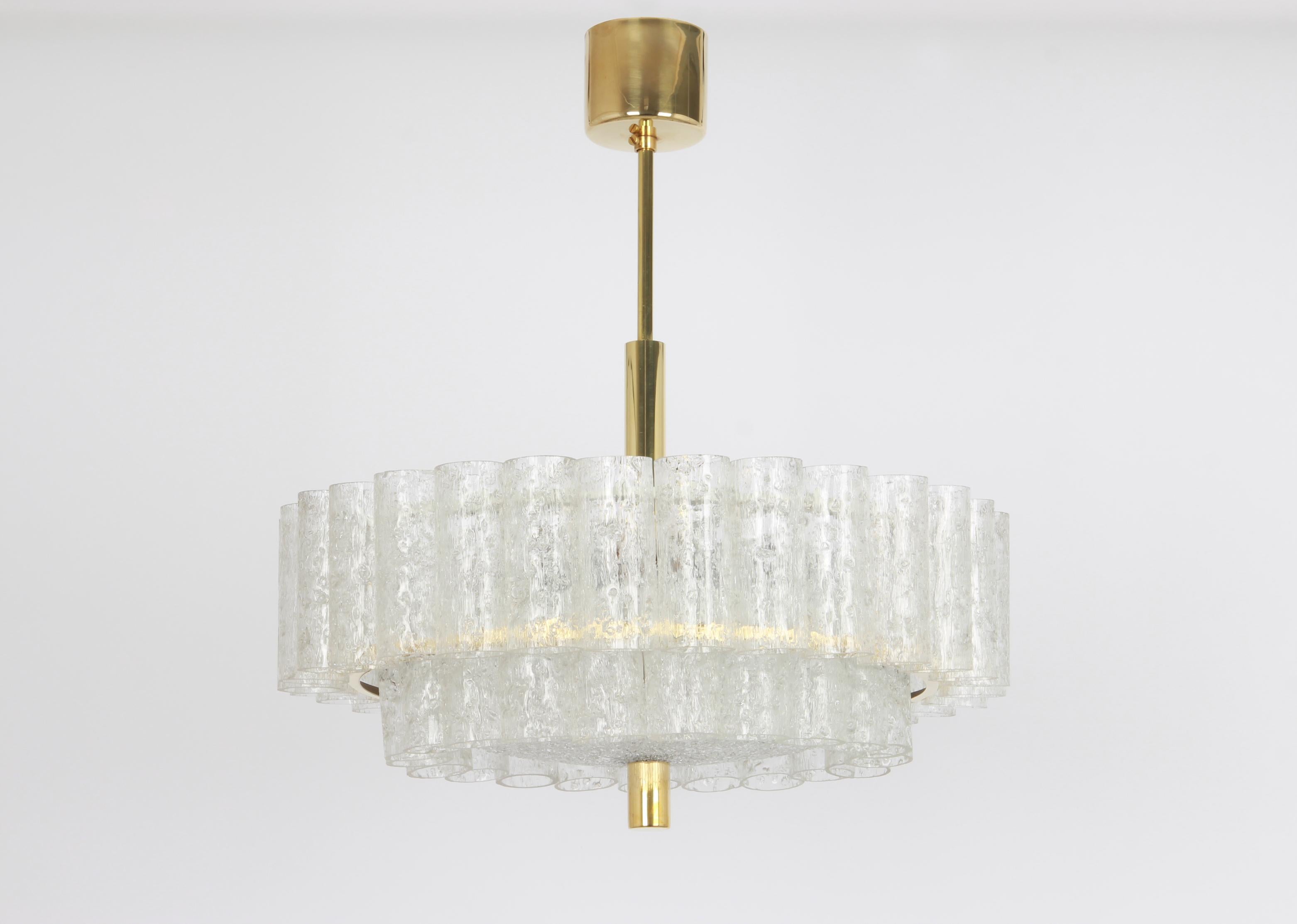 Fantastic two-tier midcentury chandelier by Doria, Germany, manufactured circa 1960-1969. Two rings of Murano glass cylinders suspended from a fixture.

Heavy quality and in very good condition. Cleaned, well-wired and ready to use. 

The