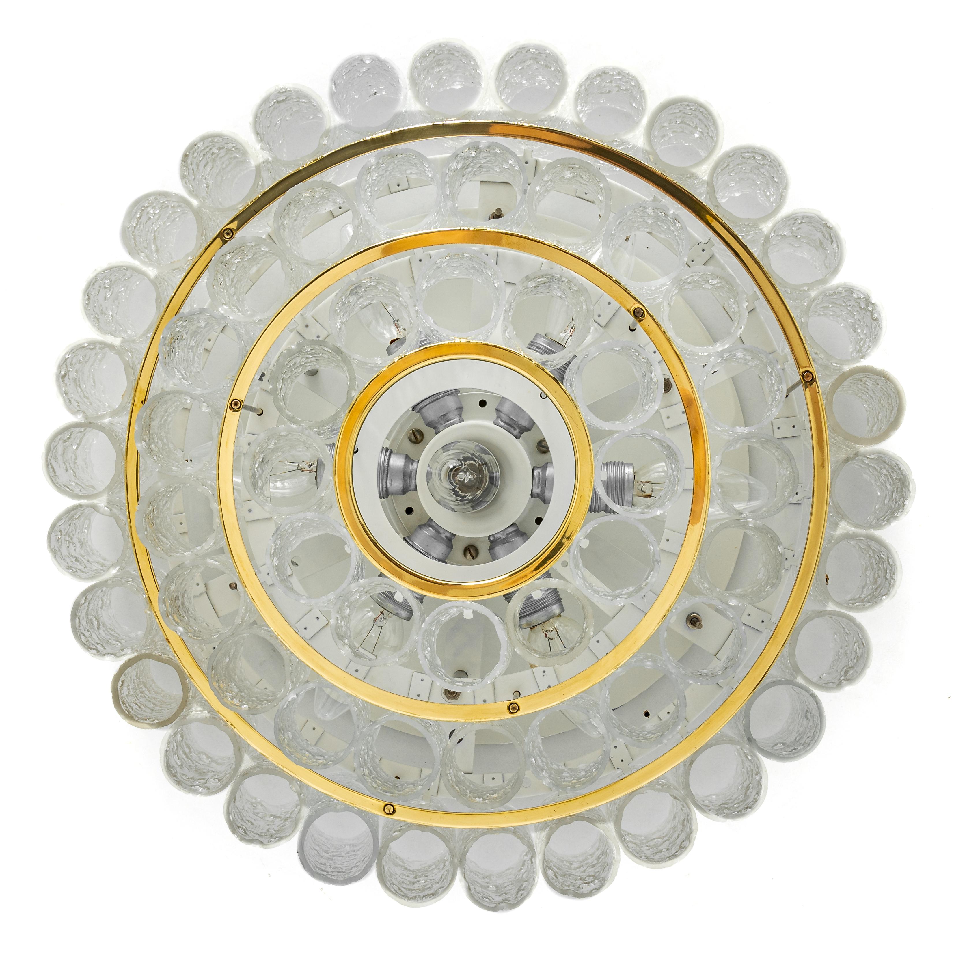 Fantastic three-tier midcentury Flush mount by Doria, Germany, manufactured, circa 1960-1969. Three rings of Murano glass cylinders suspended from a fixture.
Heavy quality and in very good condition. Cleaned, well-wired and ready to use.
The fixture