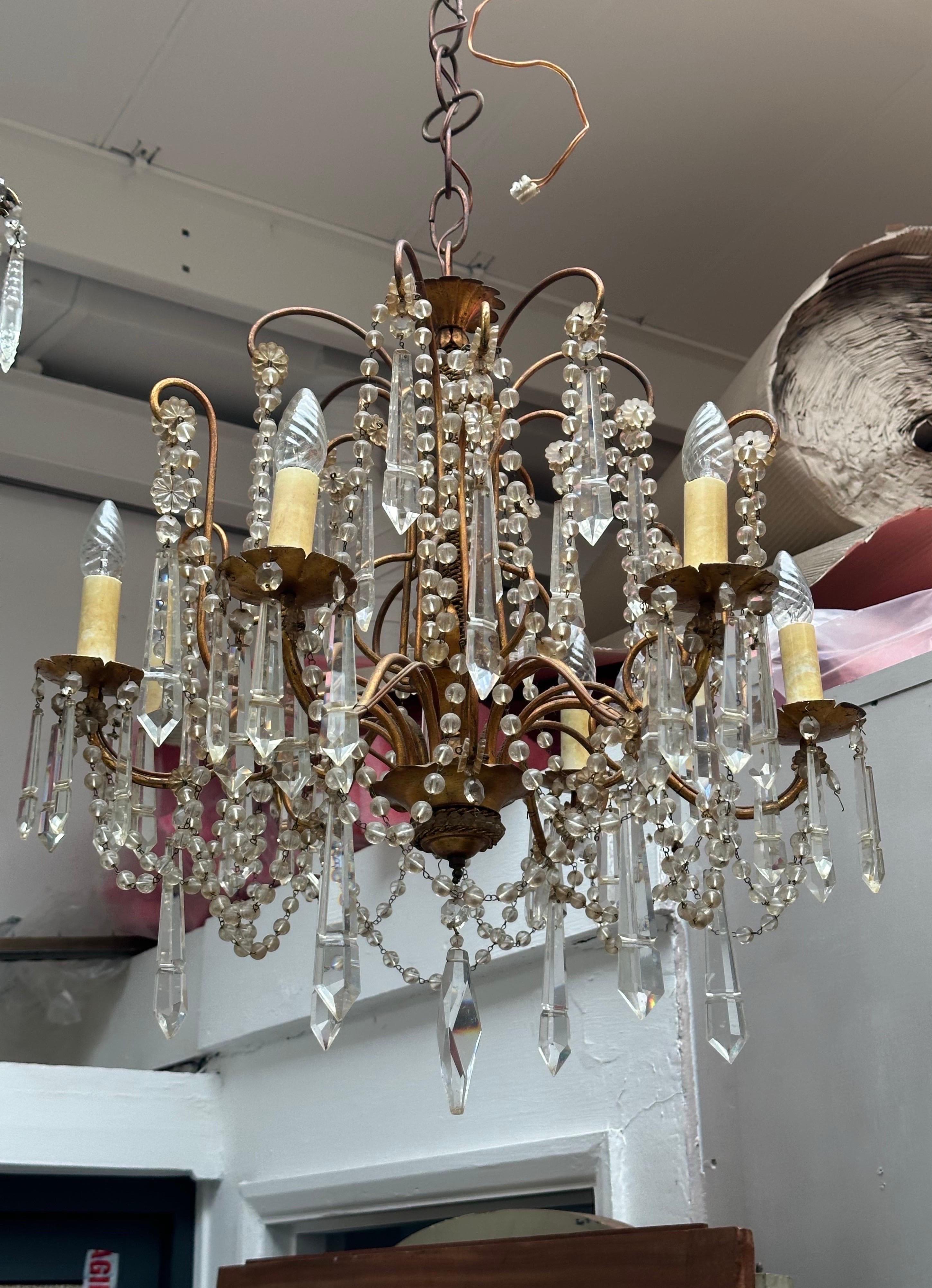 A rare Murano Italian chandelier with gilt metal frame. Lovely crystal prices. Complete. 