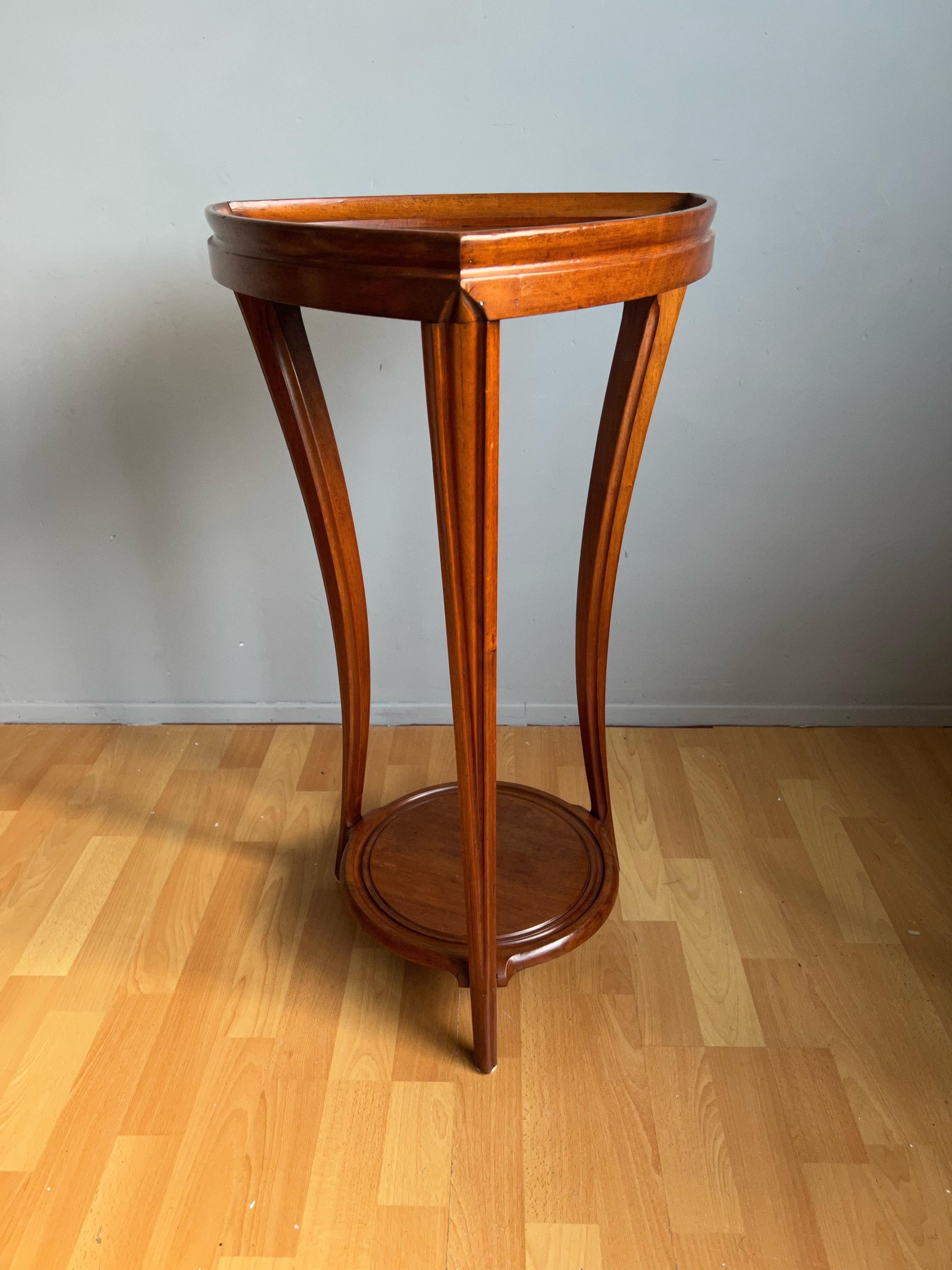 Beautiful, multipurpose, Art Nouvea table from early twentieth century France.

This elegant, truly stylish and triangle design table from early 1900s France is entirely hand-crafted out of solid nutwood. If this table is not attributed to Louis