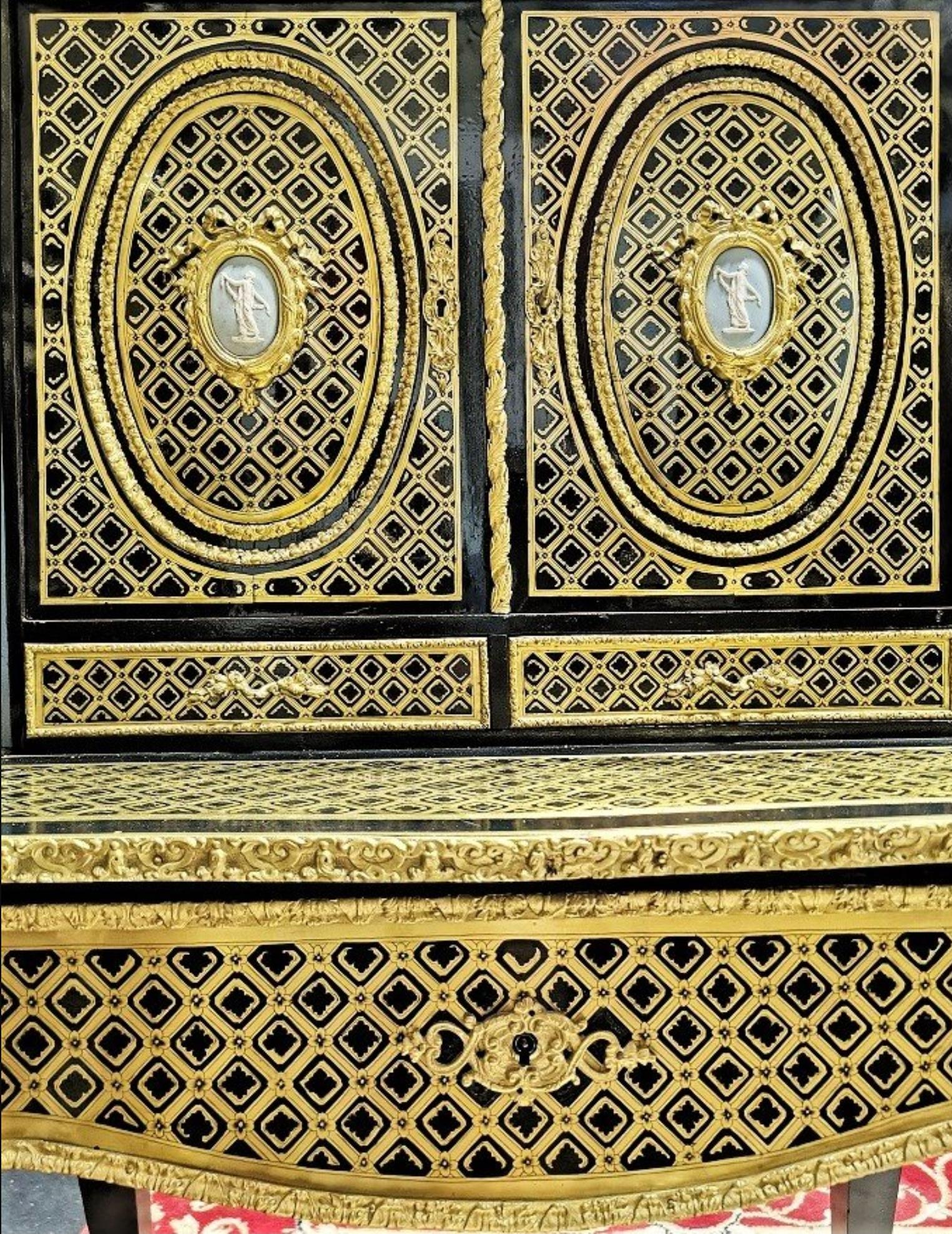 Stunning Napoleon III secretary desk Bonheur du jour style with 2 Wedgwood porcelain medallions on each front door in. Gorgeous Boulle style marquetry details of brass and ebony called 