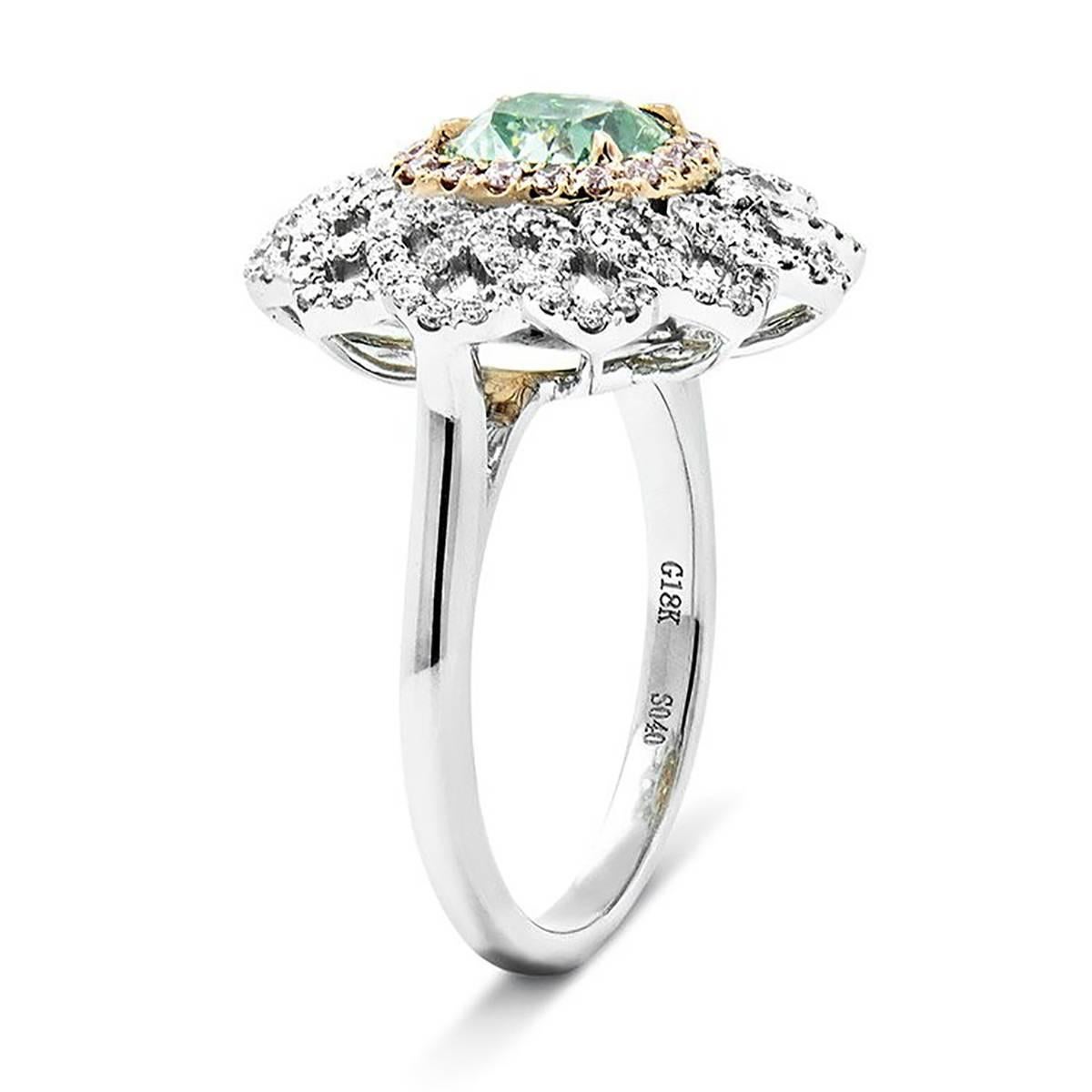 18k Ring with one GIA certified 1.39 carat Fancy Light Yellowish Green VS2 Cushion and 18 round pink diaamonds weighing 0.18 carats and 120 round white diamonds weighing 0.48 carats. 6.95g