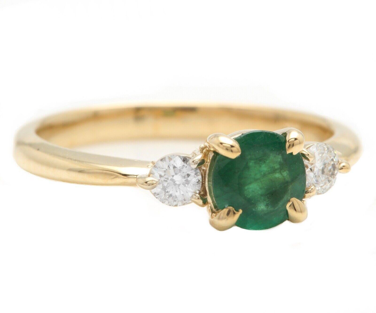 Stunning Natural Emerald and Diamond 14K Solid Yellow Gold Ring

Suggested Replacement Value: $3,500.00

Total Natural Green Emerald Weight is: Approx. 0.60 Carats (transparent)

Natural Round Diamonds Weight: Approx. 0.18 Carats (color G-H /