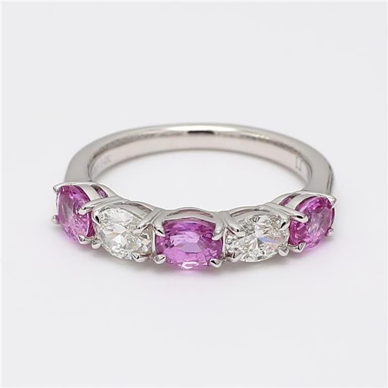 RareGemWorld's classic sapphire band. Mounted in a beautiful 14K Rose and White Gold setting with natural oval cut pink sapphires complimented by natural oval cut white diamonds. This band is guaranteed to impress and enhance your personal