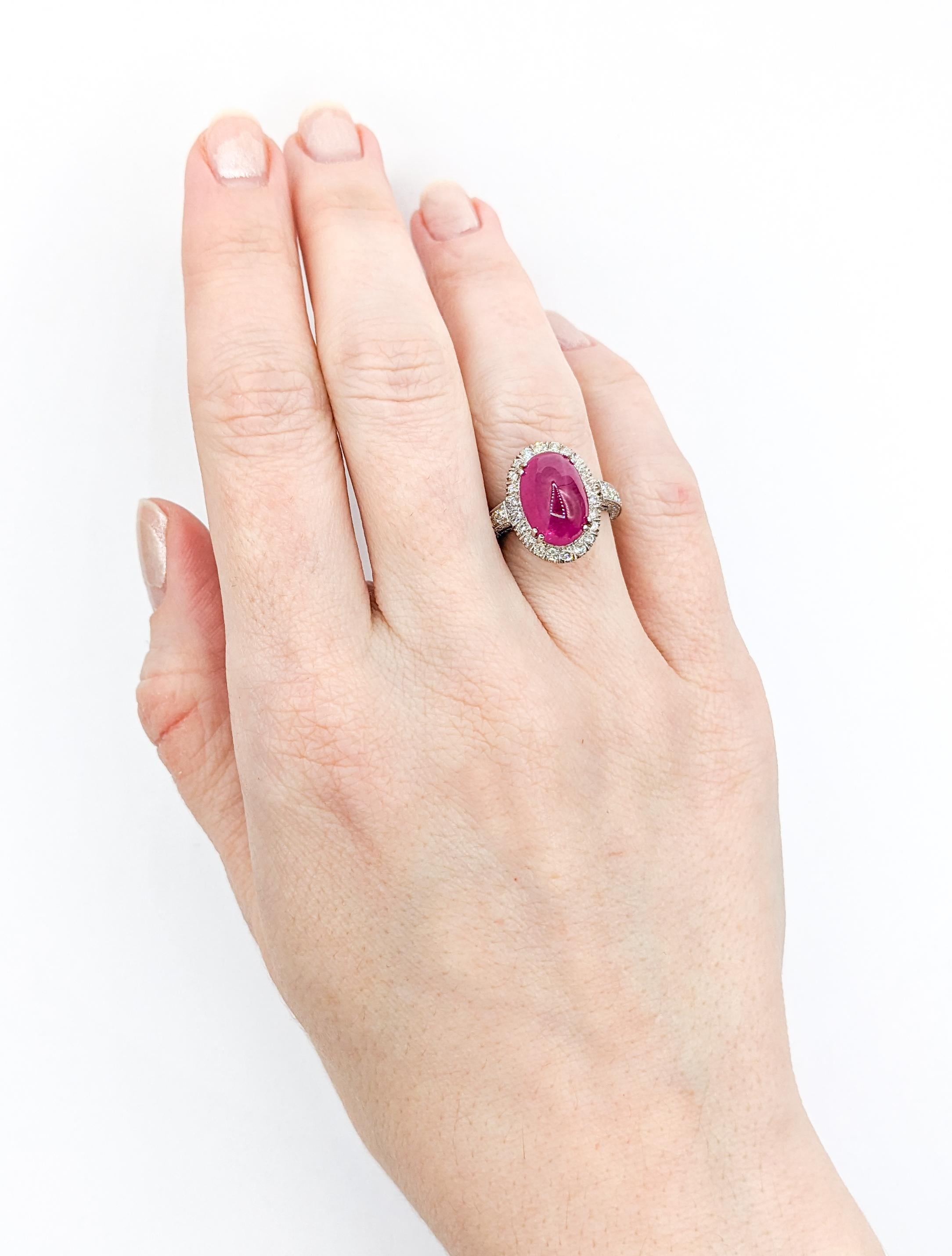 Stunning Natural Ruby Cabochon Ring with Round Diamonds in 18Kt White Gold

This lovely 18kt White Gold Ring features a stunning 12.4 x 8.5mm natural ruby cabochon centerpiece. A glittering diamond halo and shoulders with a .50ctw perfectly enhance