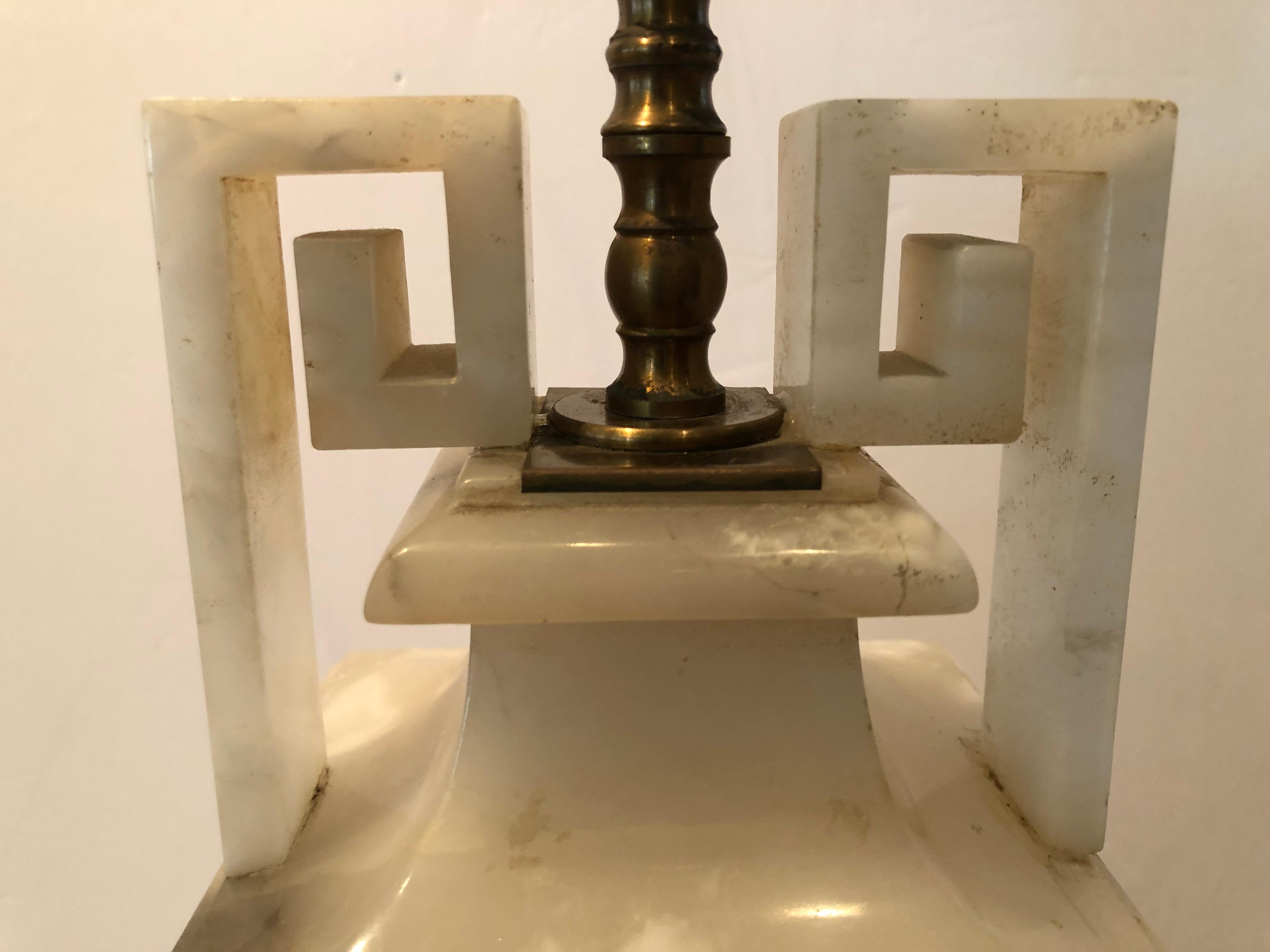 Neoclassical style vintage lamp made of alabaster having beautiful urn form accentuated with Greek key handles. The alabaster is a creamy white with black grey veining.