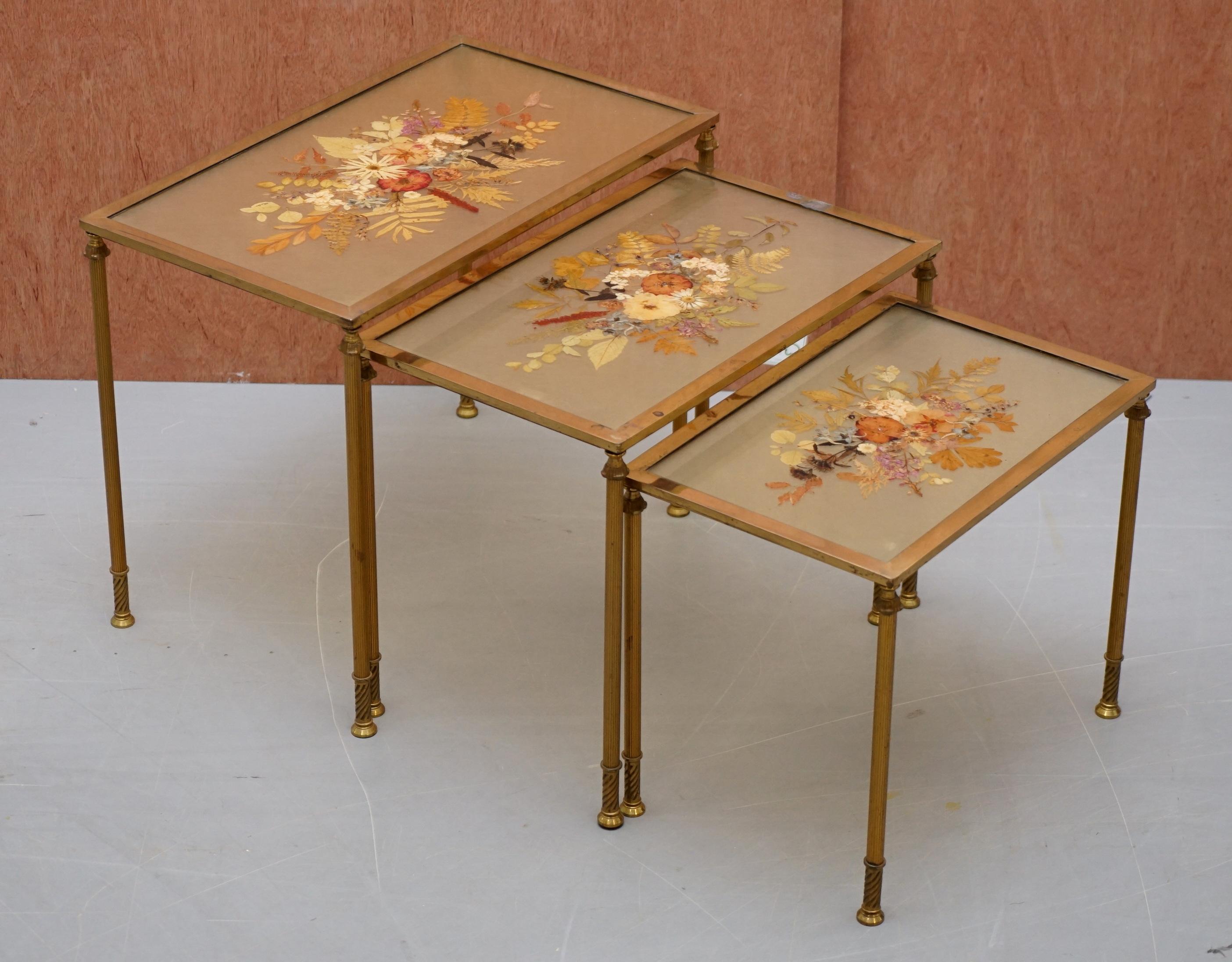 We are delighted to offer for sale this rare and collectable nest of three French pressed flower tables with bronzed frames

I have never seen tables like this before, they have the most wonderful pressed flower tops which have been set in some