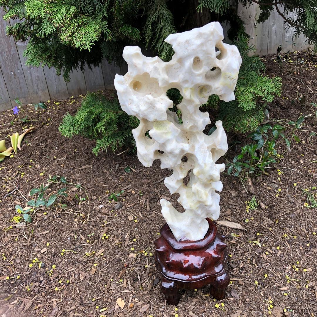 This is a beautiful example of an old white antique Chinese Taihu viewing stone or scholar rock mounted in a custom hand carved hard wood base.

Dimensions: 17 inches high with stand and 7.5 inches wide

Taihu stones are known as infinity stones