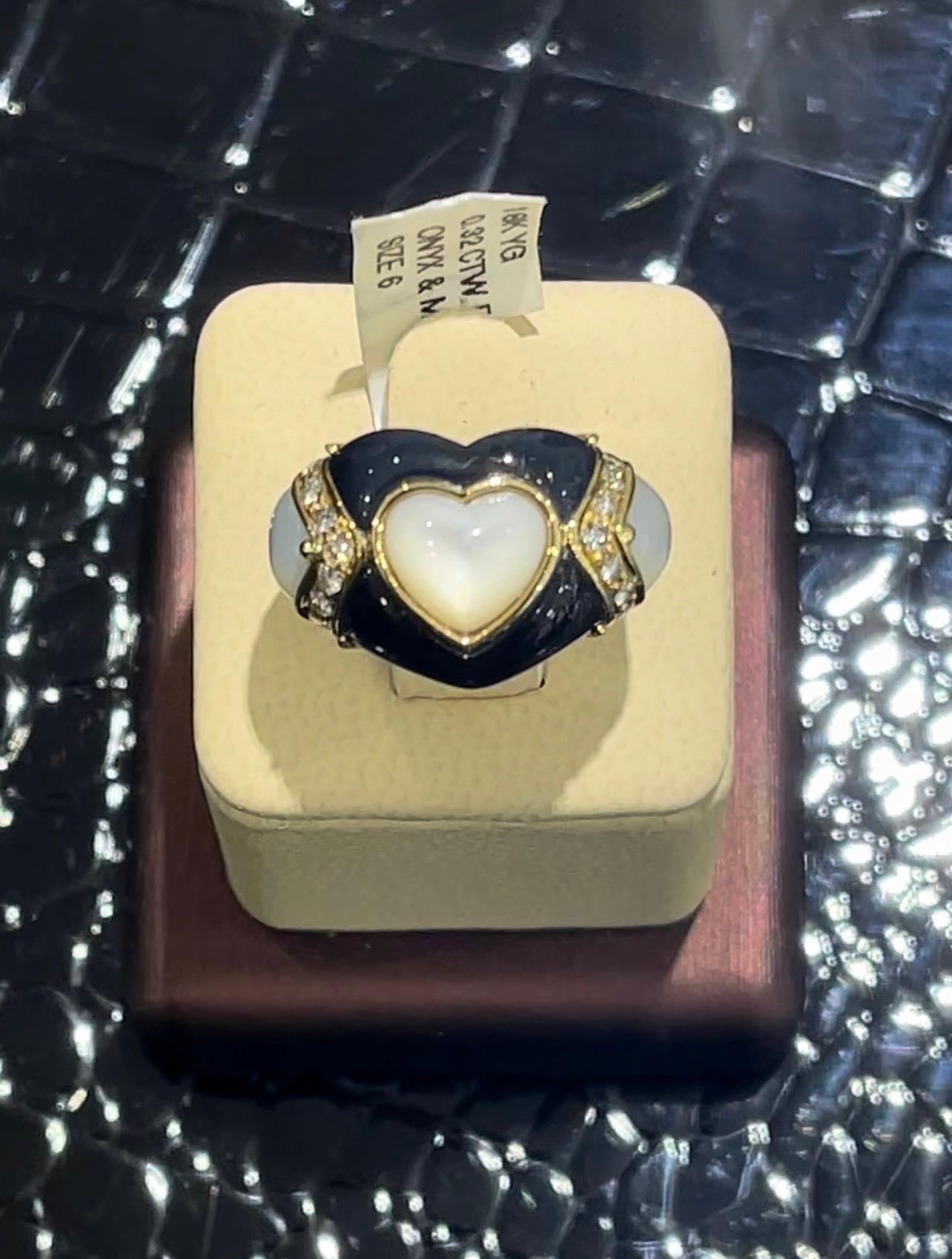 Stunning Onyx, Mother Of Pearl And Diamond Heart Ring In 18k,

0.32 carats in diamonds,

Size 6