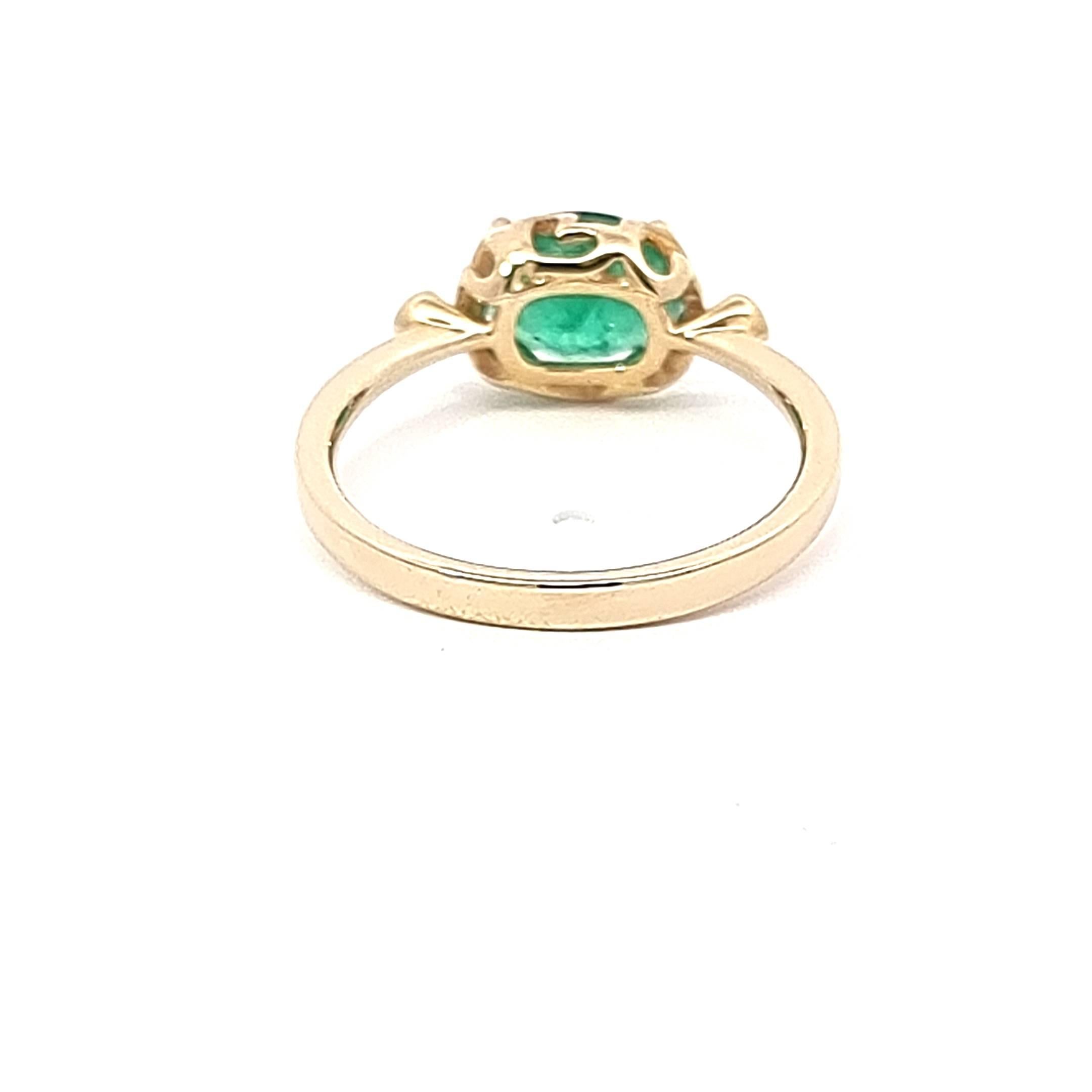 Oval Cut Stunning Oval Emerald Ring with Two White Diamonds on the Side in 14K Gold For Sale