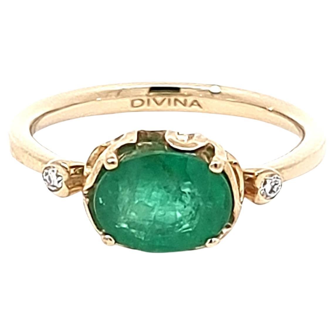 Stunning Oval Emerald Ring with Two White Diamonds on the Side in 14K Gold For Sale