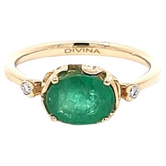 Stunning Oval Emerald Ring with Two White Diamonds on the Side in 14K Gold